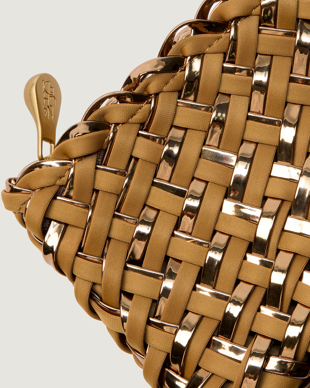 Close-up of included coordinating woven zippered pouch.