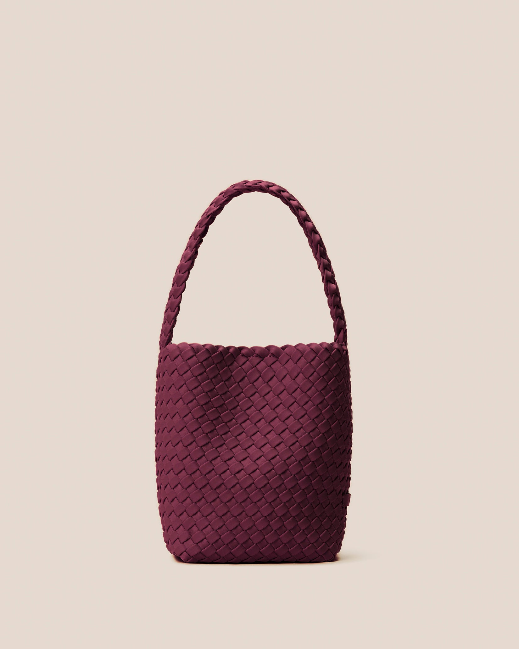 Nomad Small Hobo Bag in Bordeaux, a rich burgundy tone, in handwoven neoprene featuring an open top with magnetic snap closure, and handwoven shoulder strap lays comfortably flat.