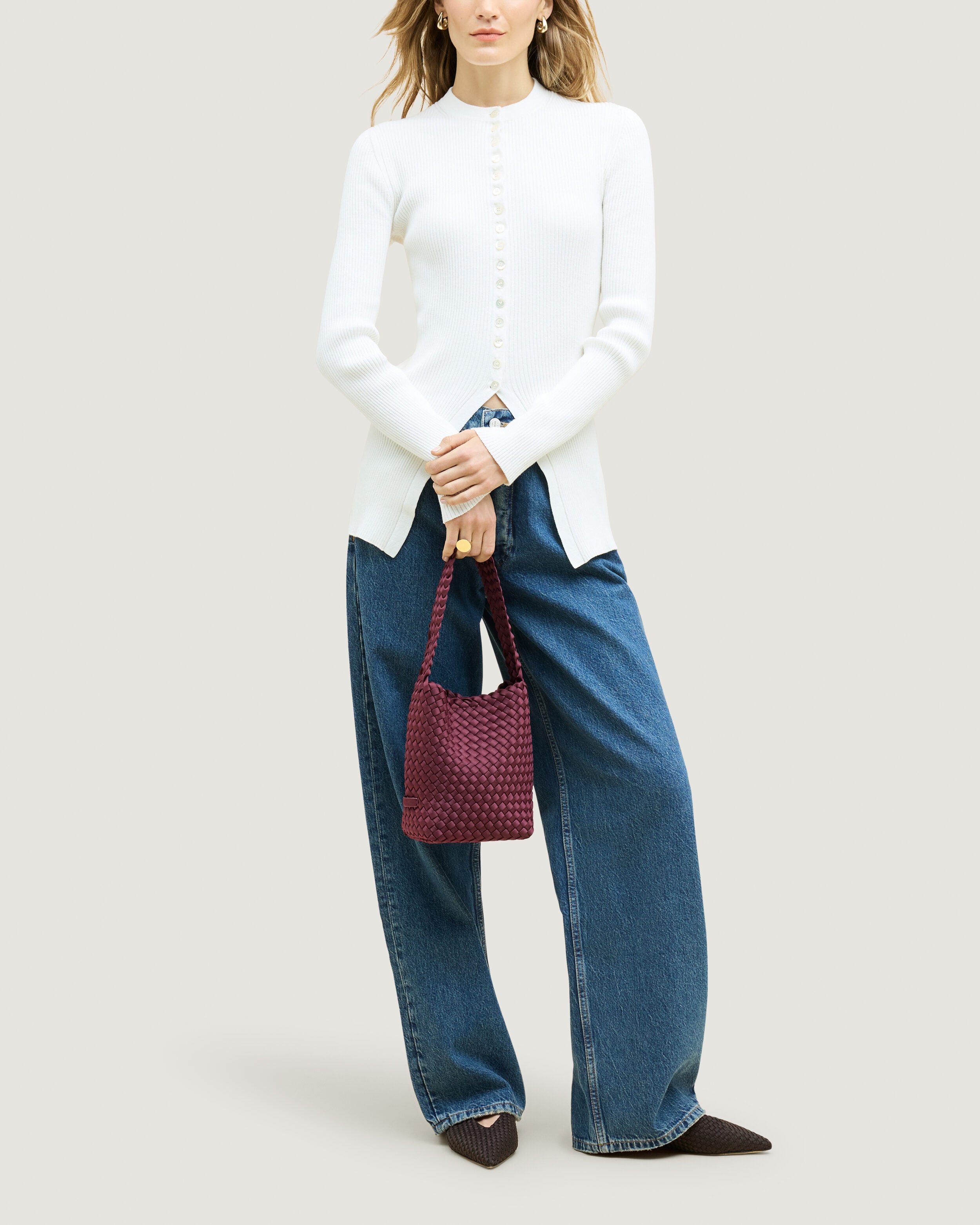 Nomad Hobo in Bordeaux shown on model to illustrate scale and soft silhouette.