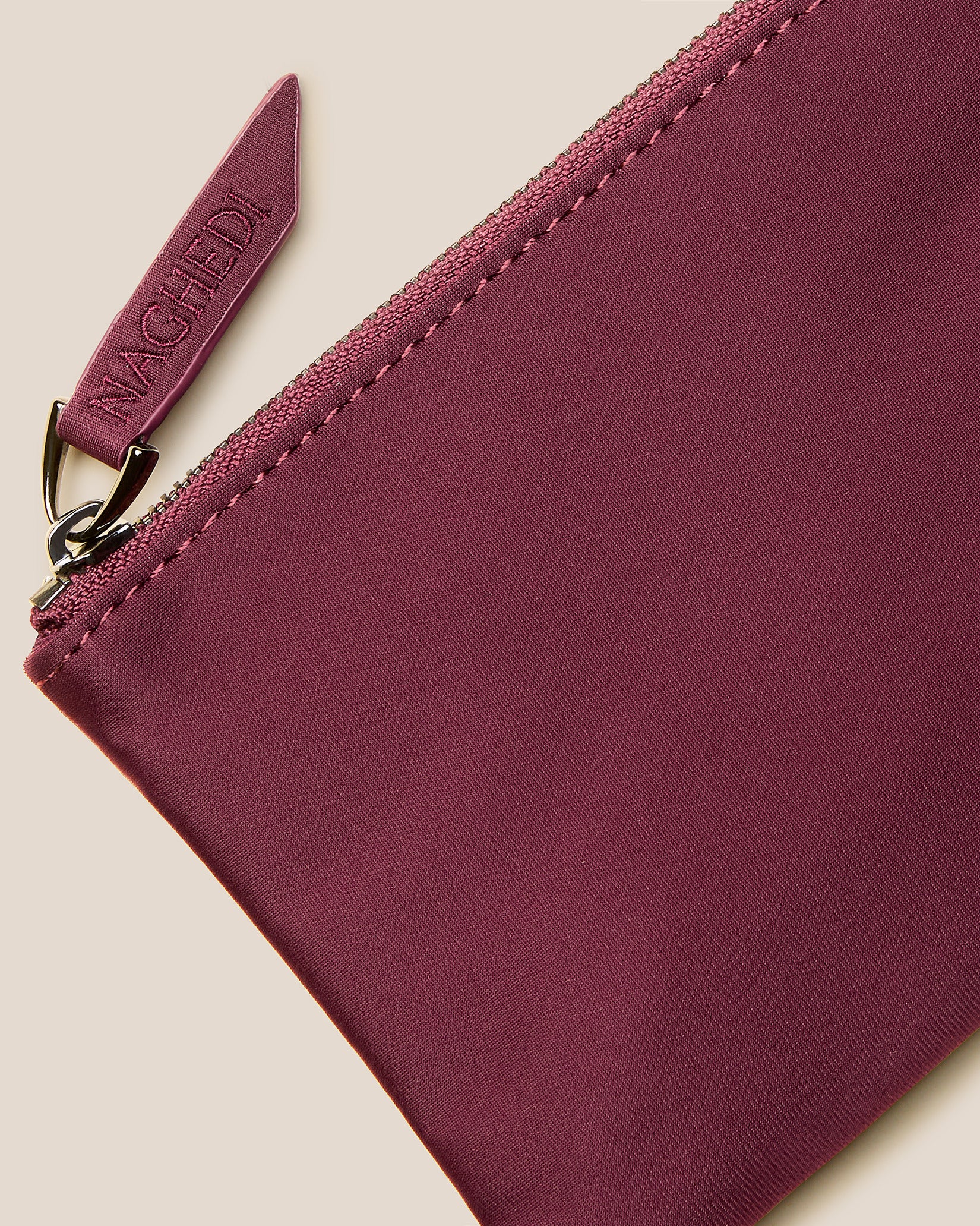 Close-up of included coordinating neoprene zippered pouch.