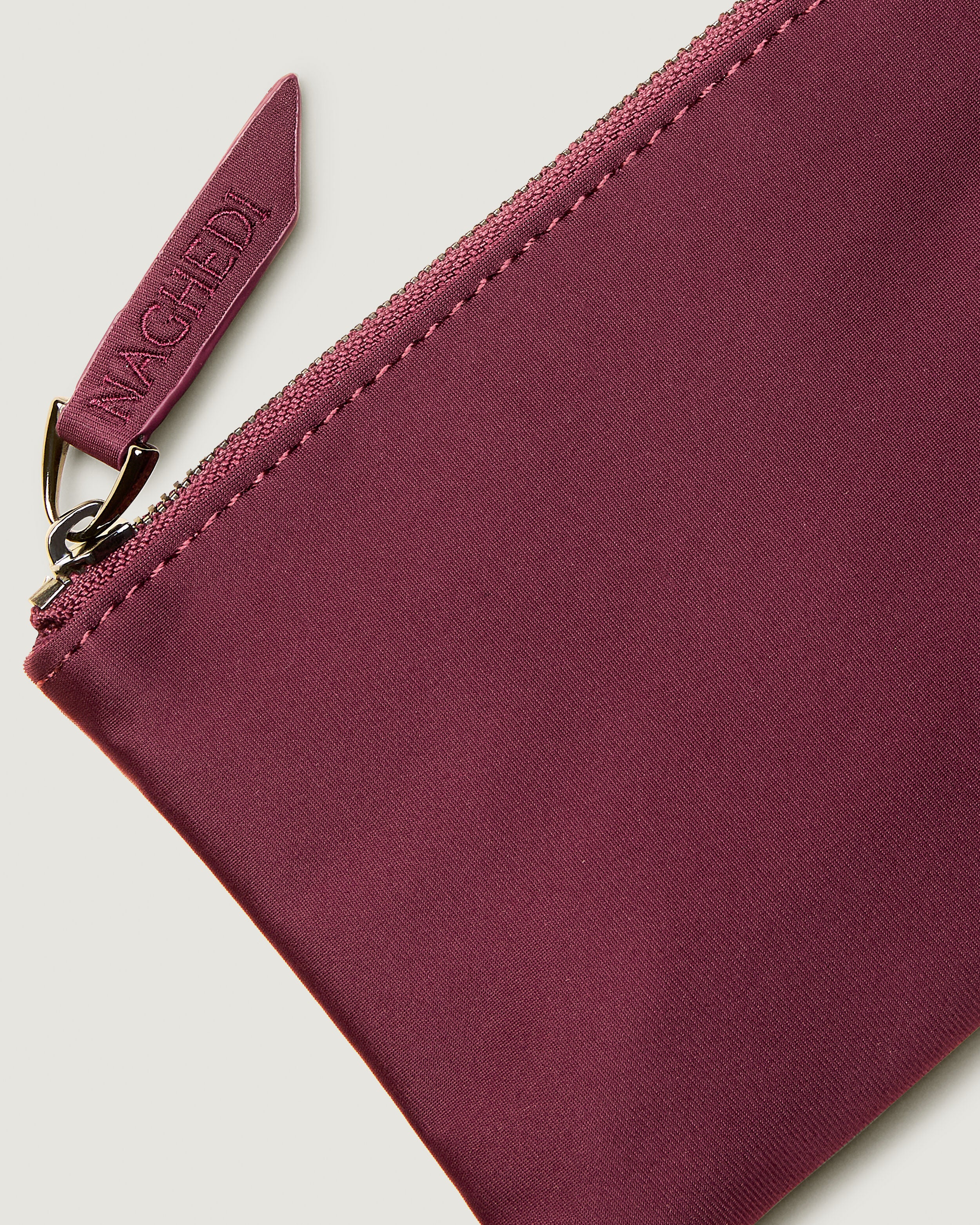 Close-up of included coordinating neoprene zippered pouch.
