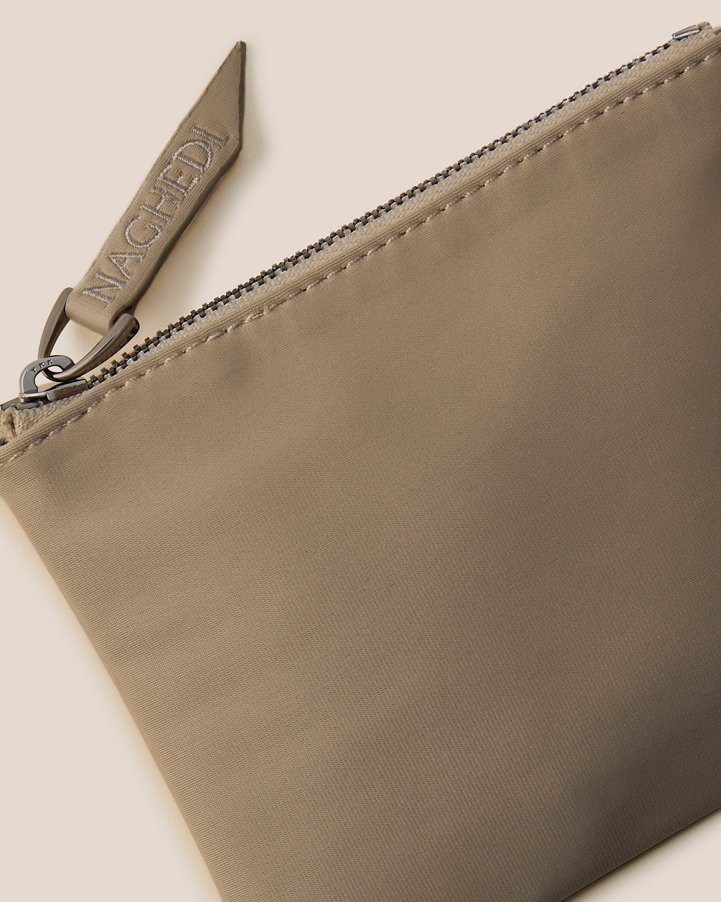 Close-up of included coordinating neoprene zippered pouch.