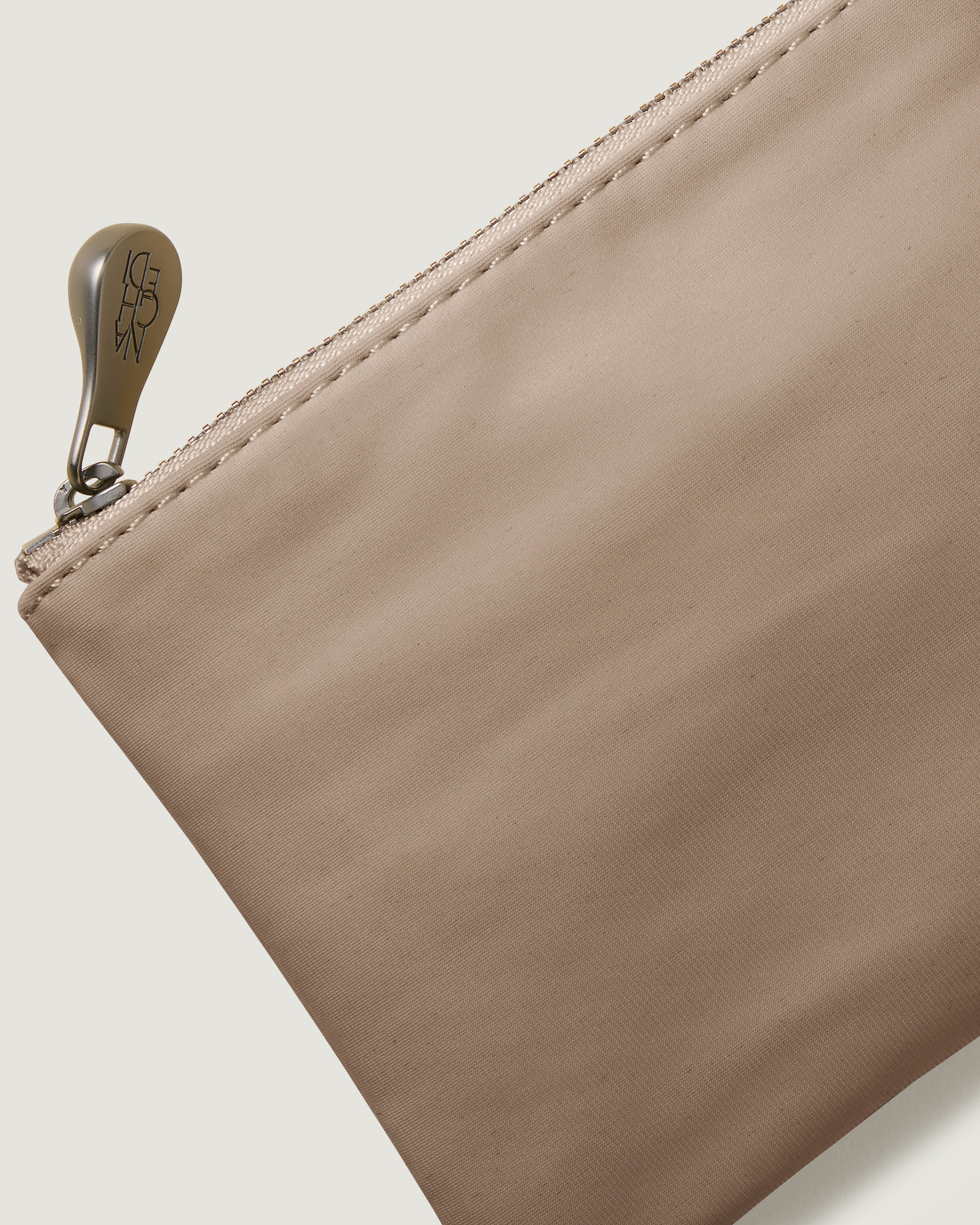 Close-up of included coordinating neoprene zippered pouch.