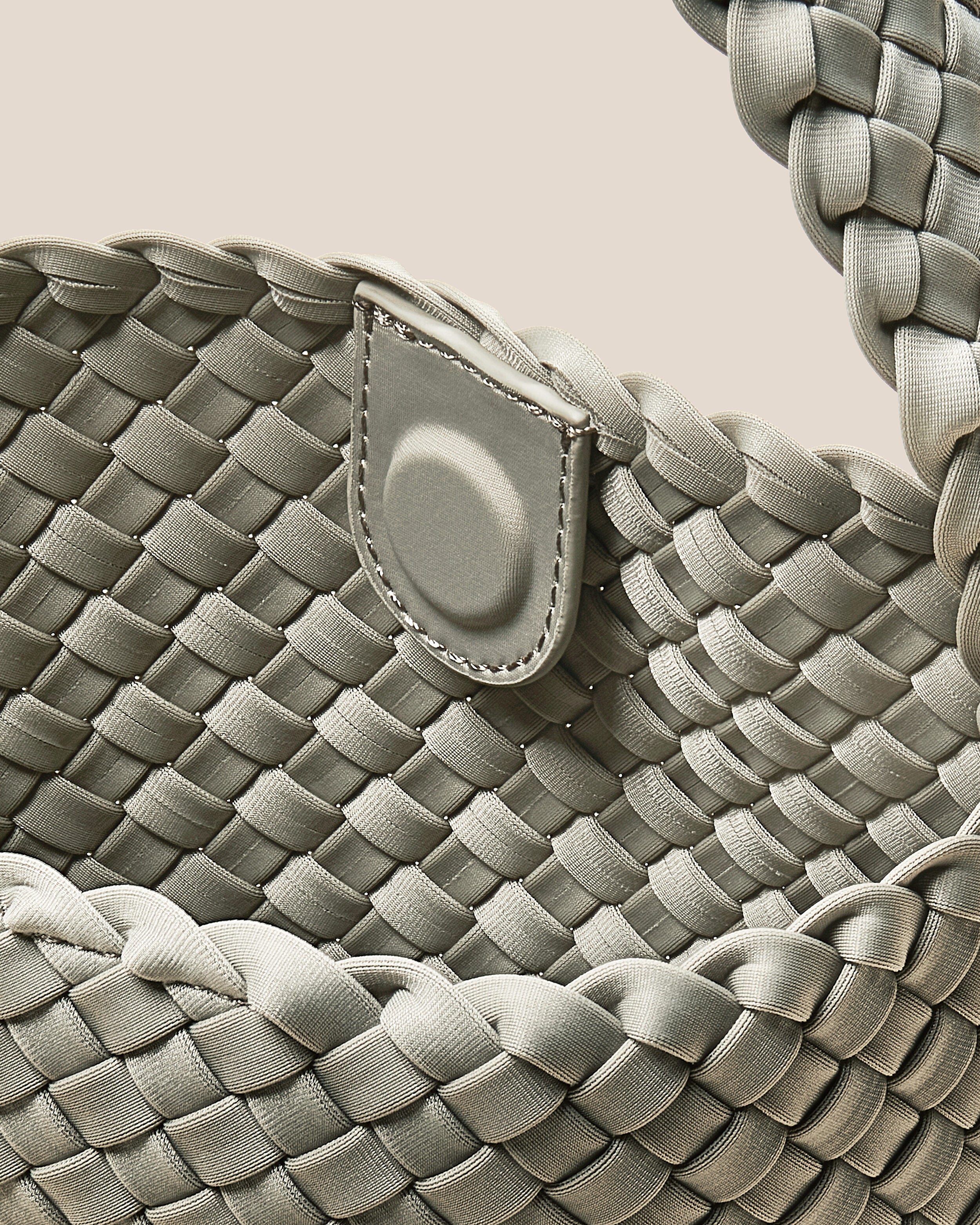 Interior close-up of Nomad Hobo in Celadon showing its open top with magnetic snap closure, and unlined interior.