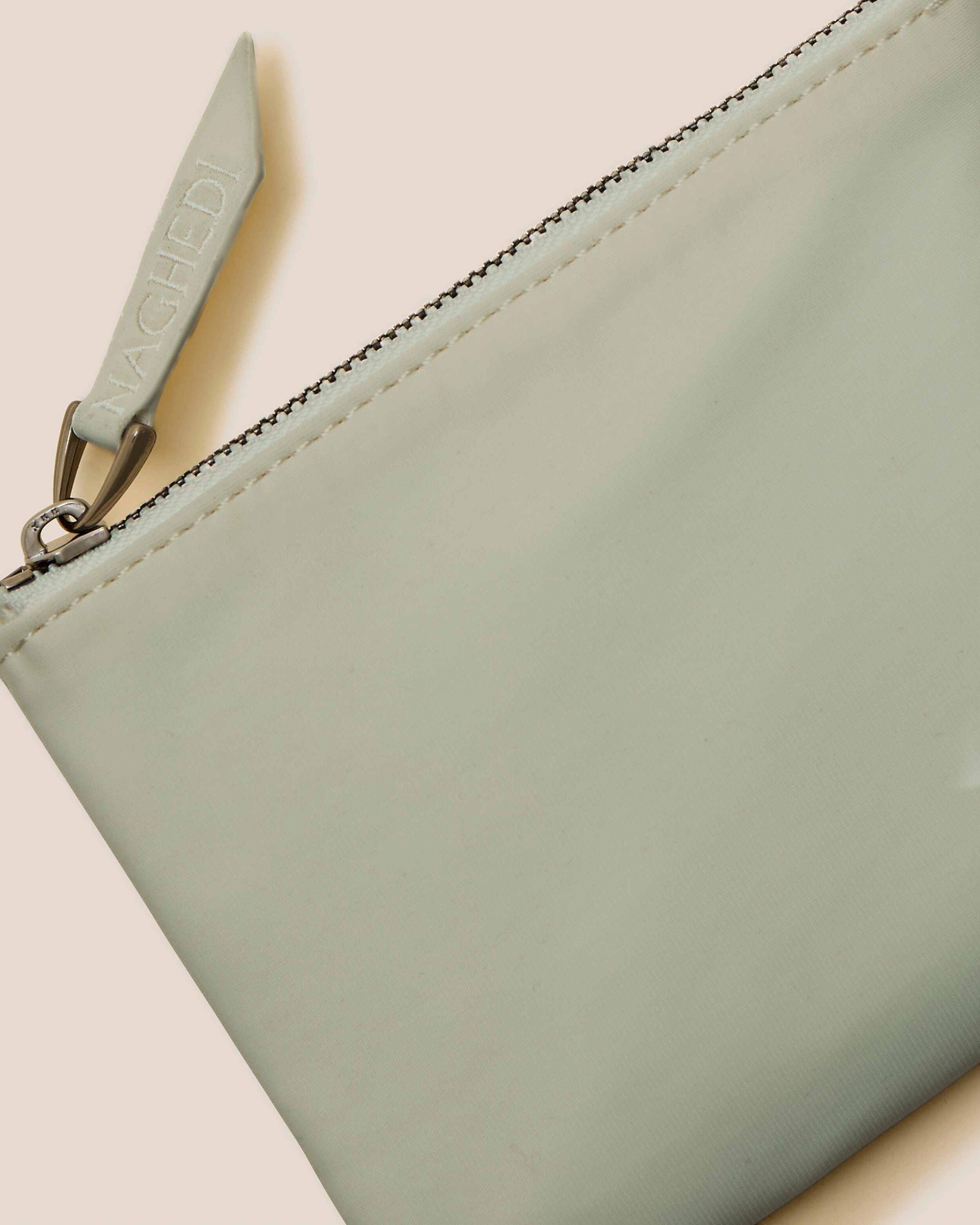 Close-up of included coordinating neoprene zippered pouch.