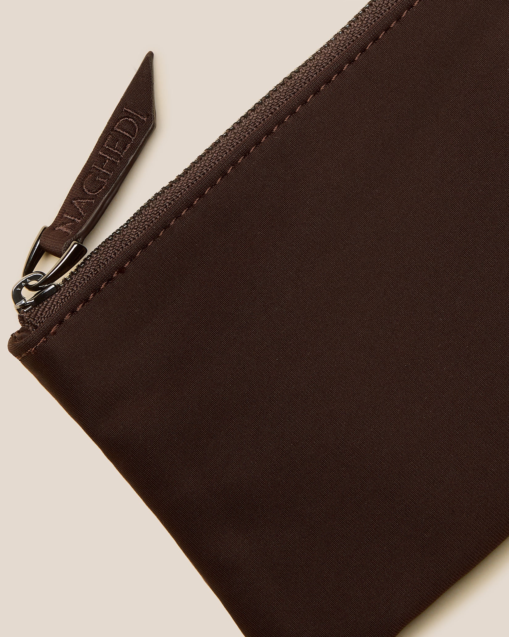 Close-up of included coordinating neoprene zippered pouch.