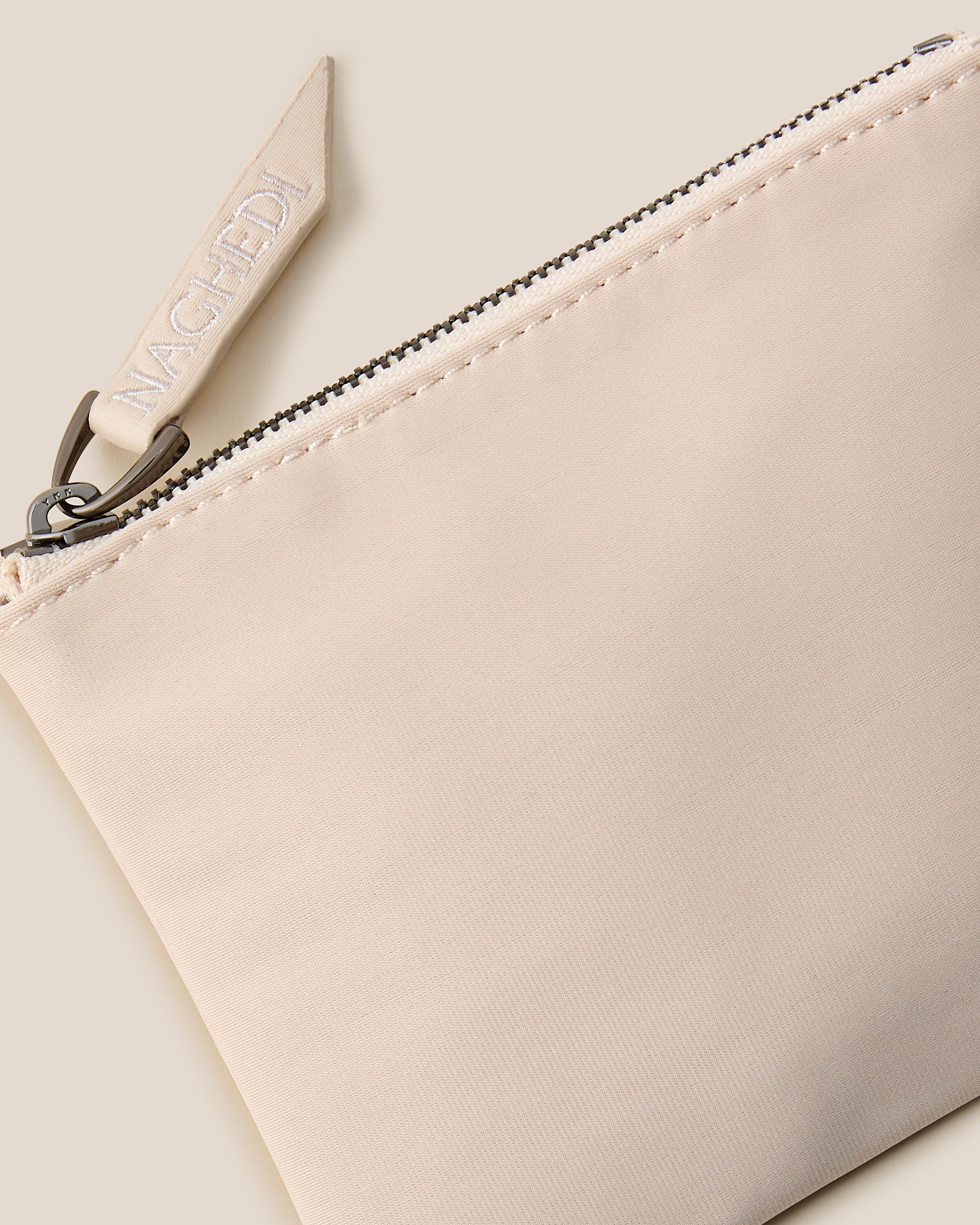 Close-up of included coordinating neoprene zippered pouch.