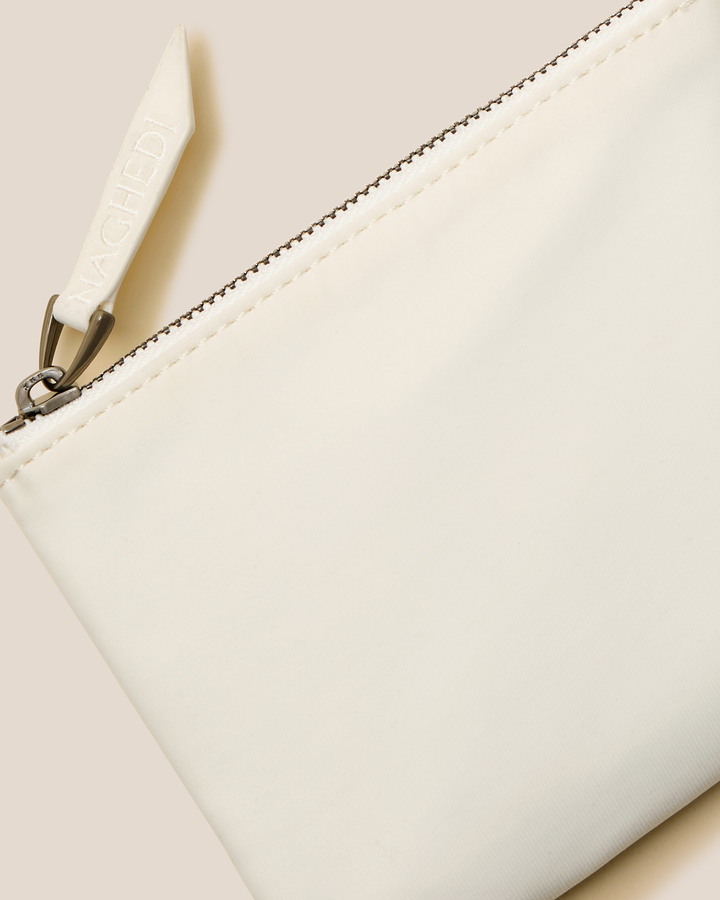 Close-up of included coordinating neoprene zippered pouch.