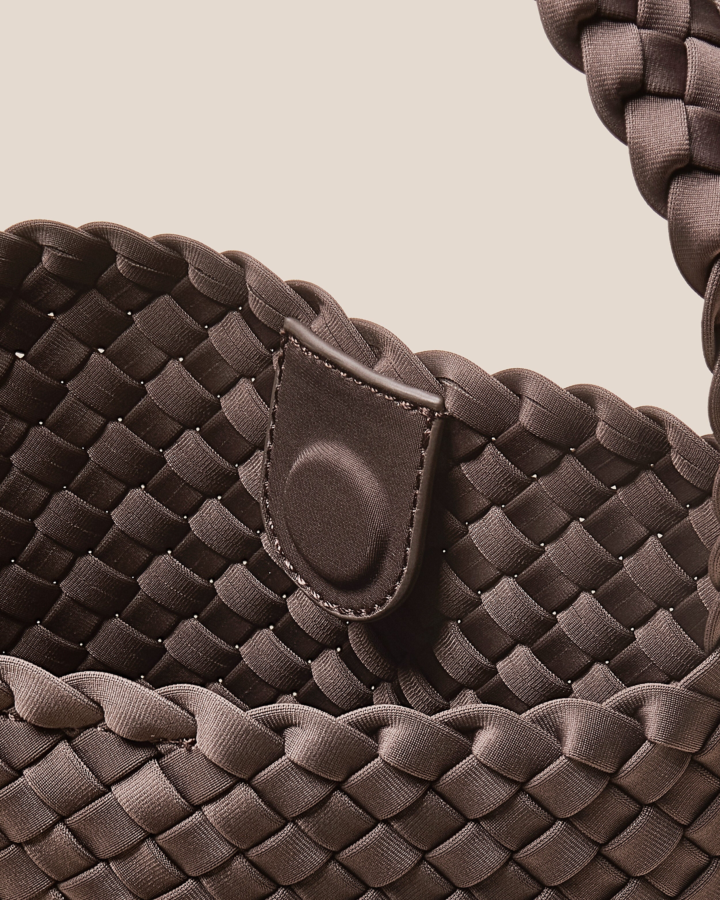 Interior close-up of Nomad Hobo in Napa showing its open top with magnetic snap closure, and unlined interior.