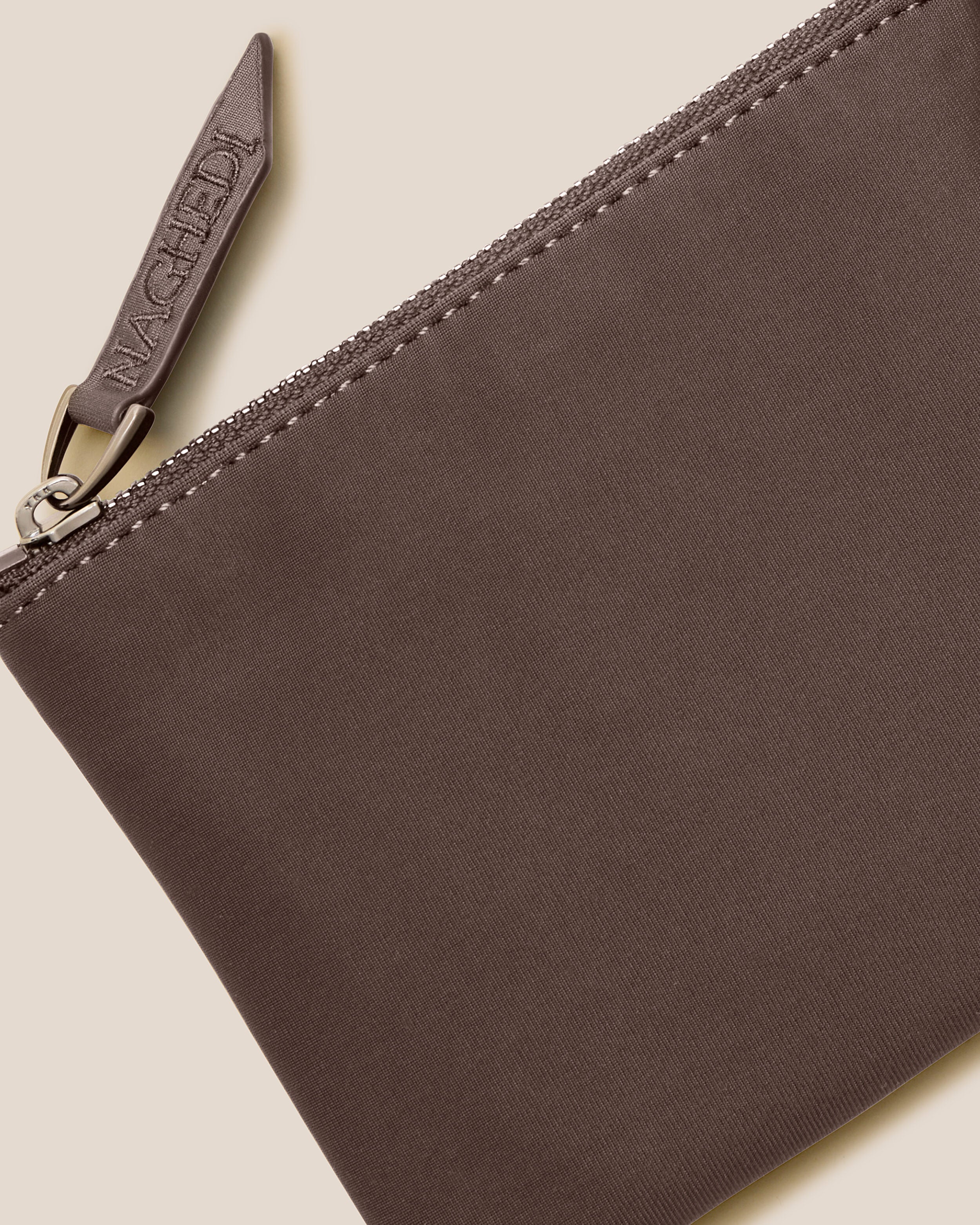 Close-up of included coordinating neoprene zippered pouch.