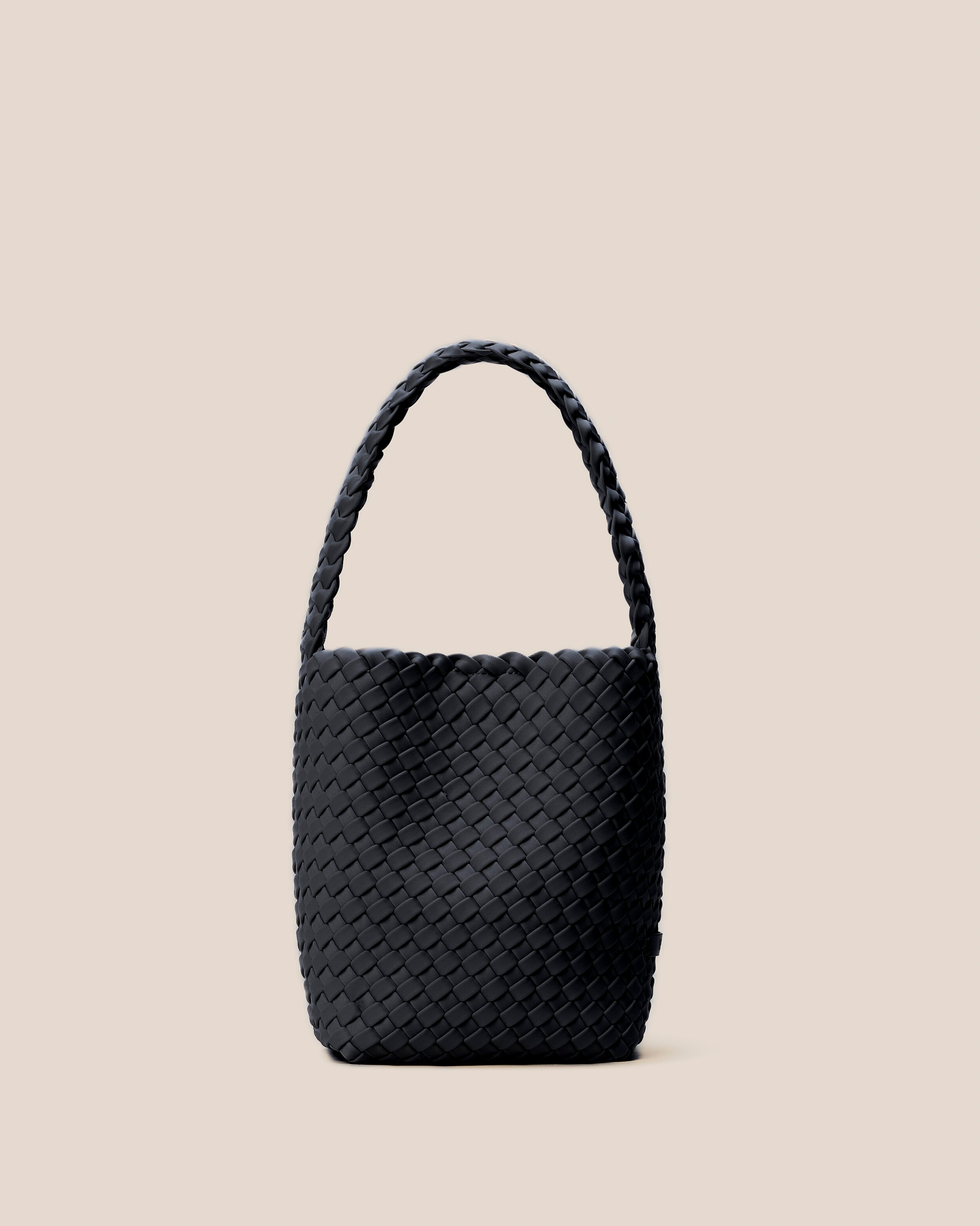 Nomad Hobo in Onyx, a true black tone, in handwoven neoprene, featuring an open top with magnetic snap closure, and handwoven shoulder strap lays comfortably flat.