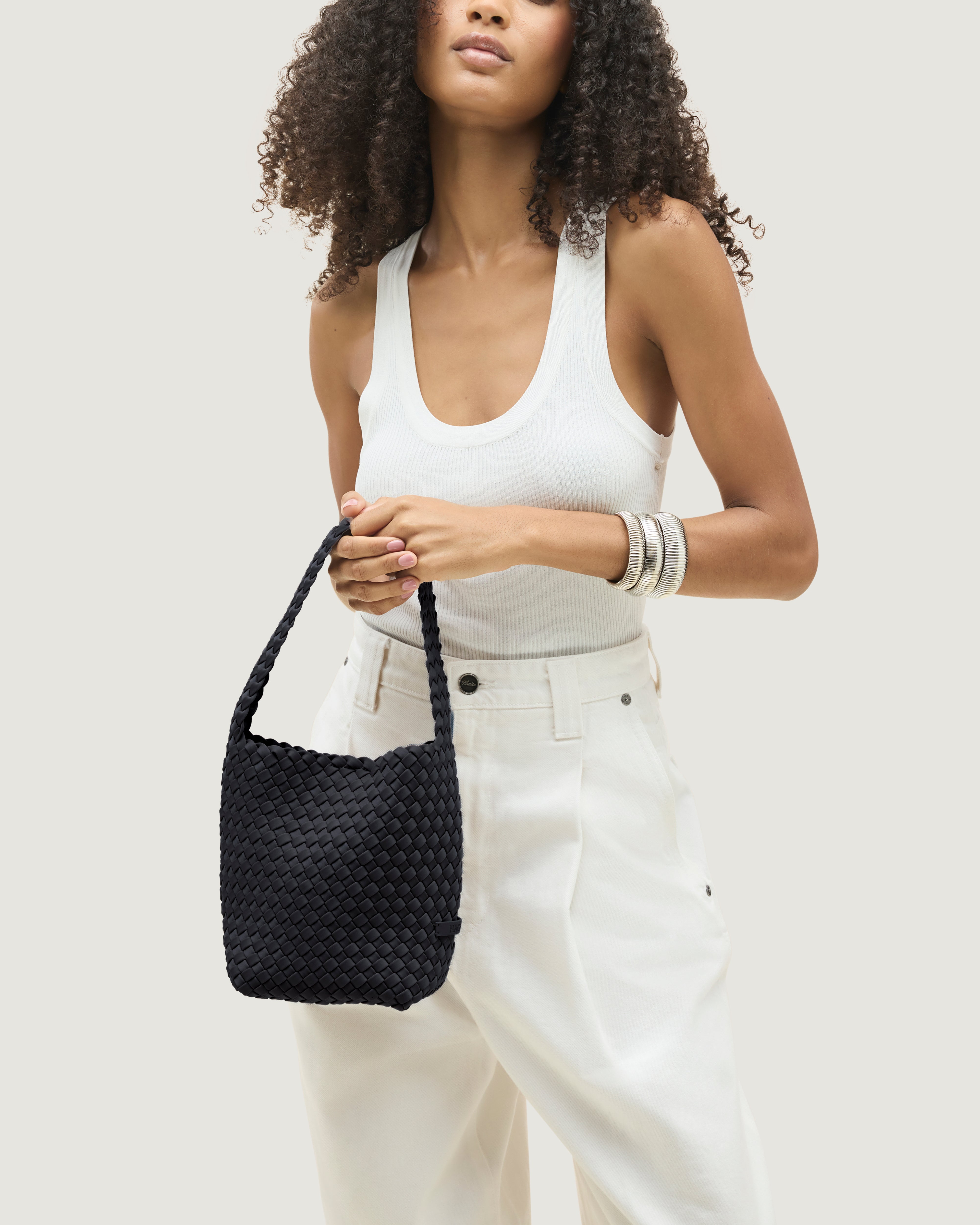 Nomad Hobo in Onyx shown on model to illustrate scale and soft silhouette.