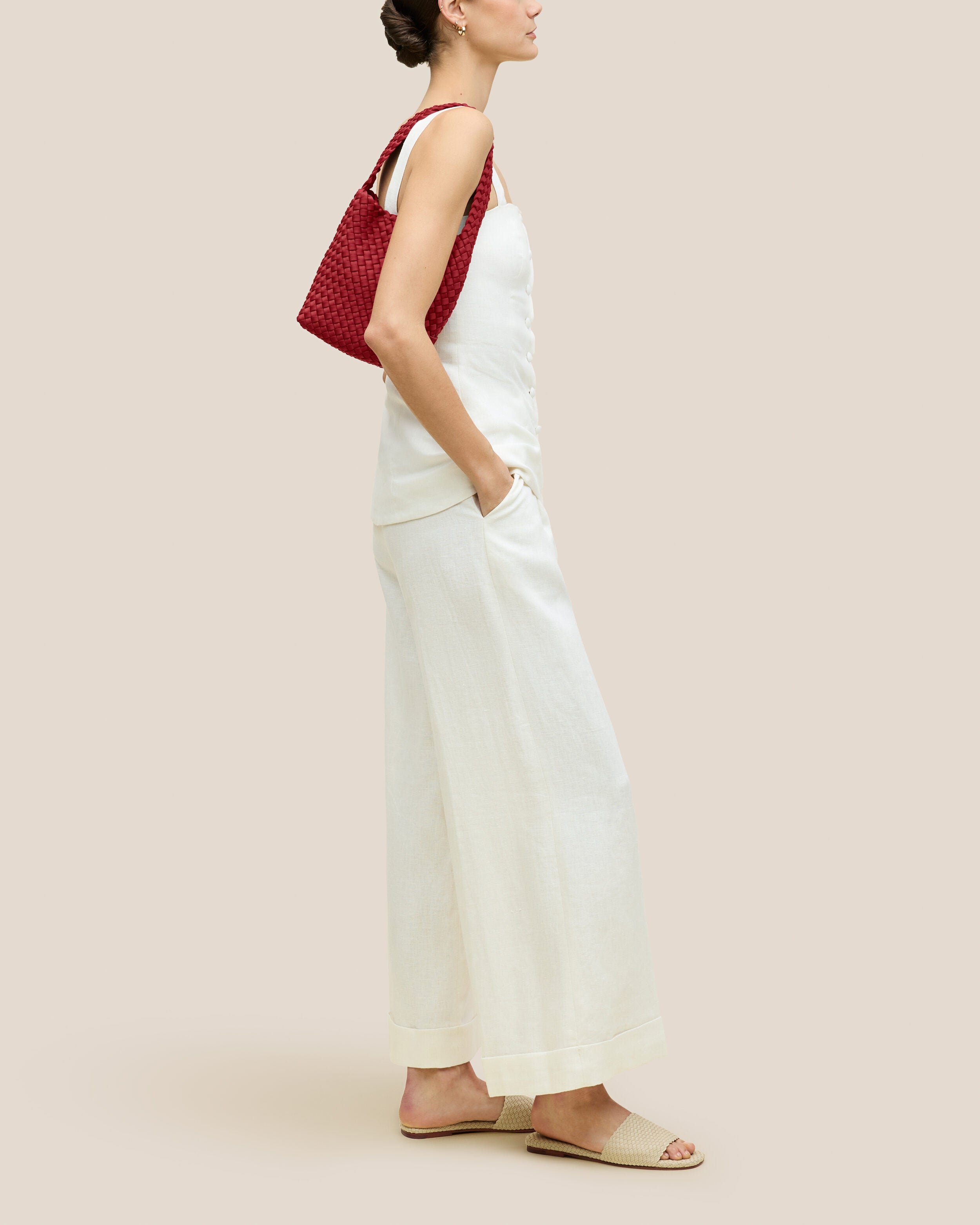 Nomad Hobo in Rosso shown on model to illustrate scale and soft silhouette.