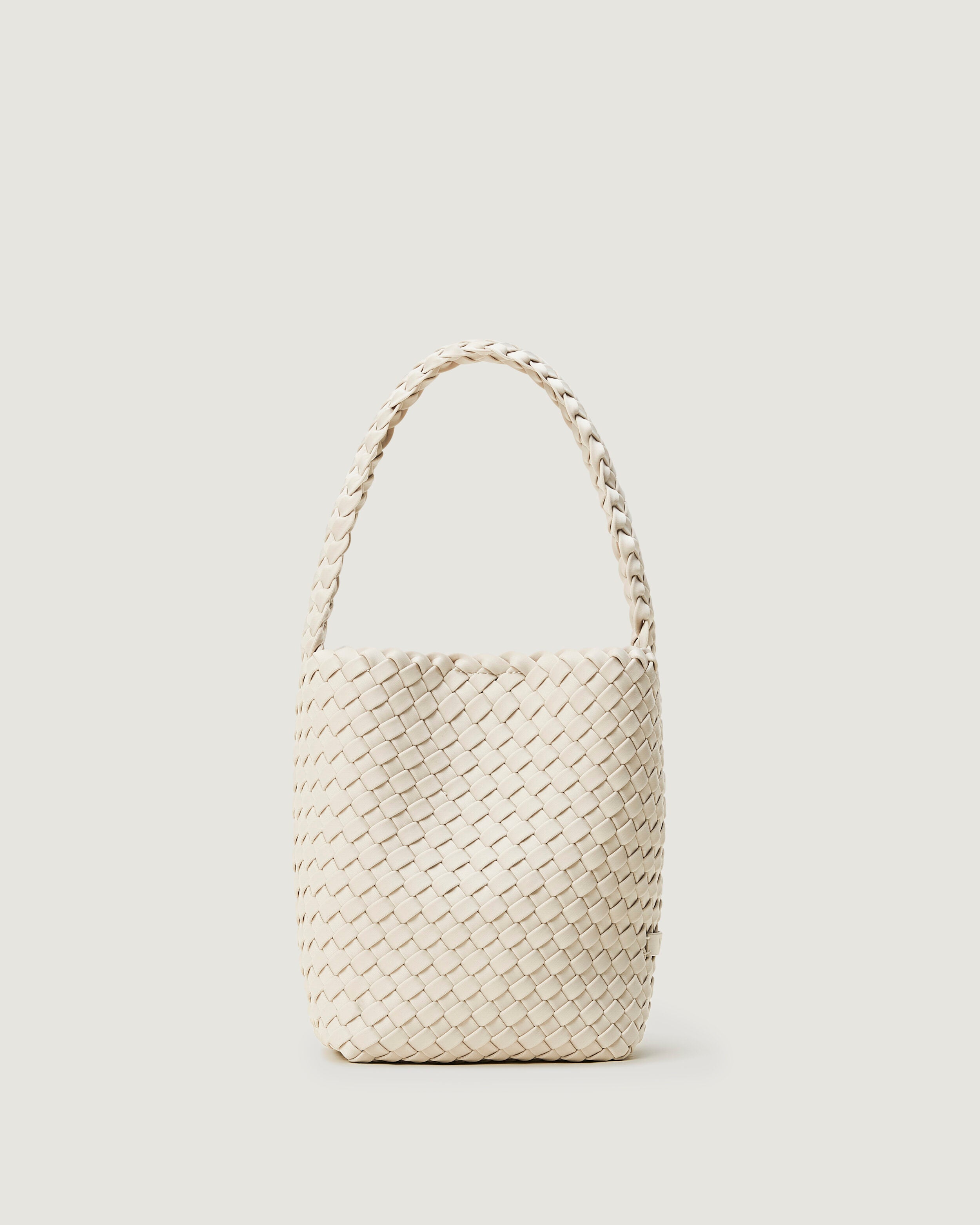 Nomad Hobo in Salt in handwoven neoprene, featuring an open top with magnetic snap closure, and handwoven shoulder strap lays comfortably flat.