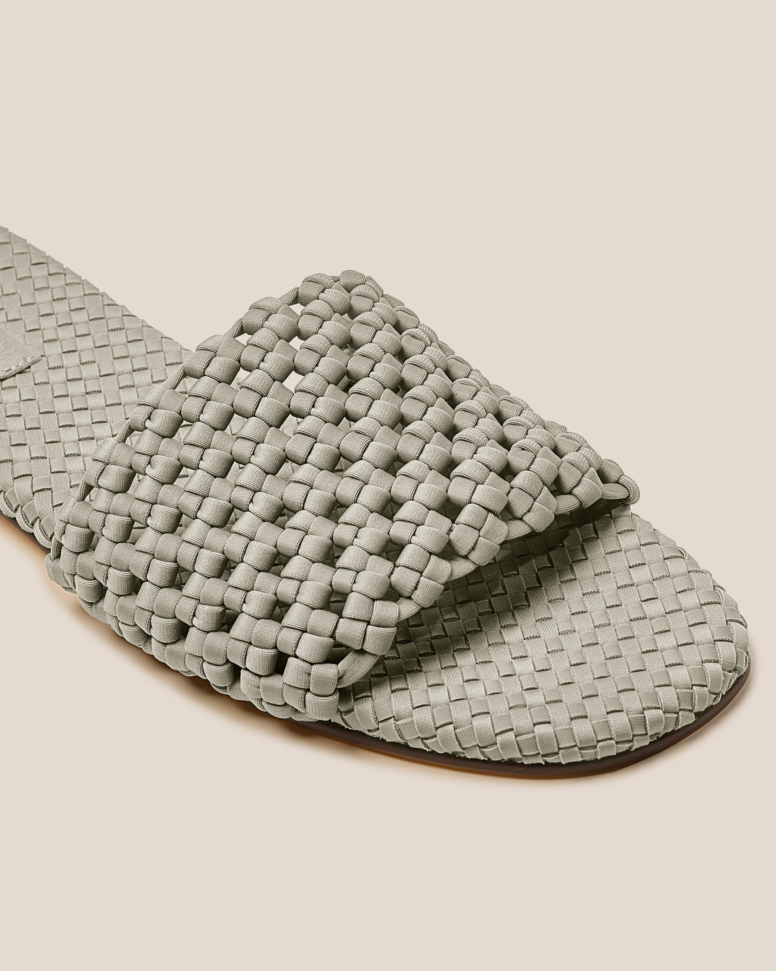 Close-up of The Ojai Slide in Celadon showing its open toe and round silhouette.