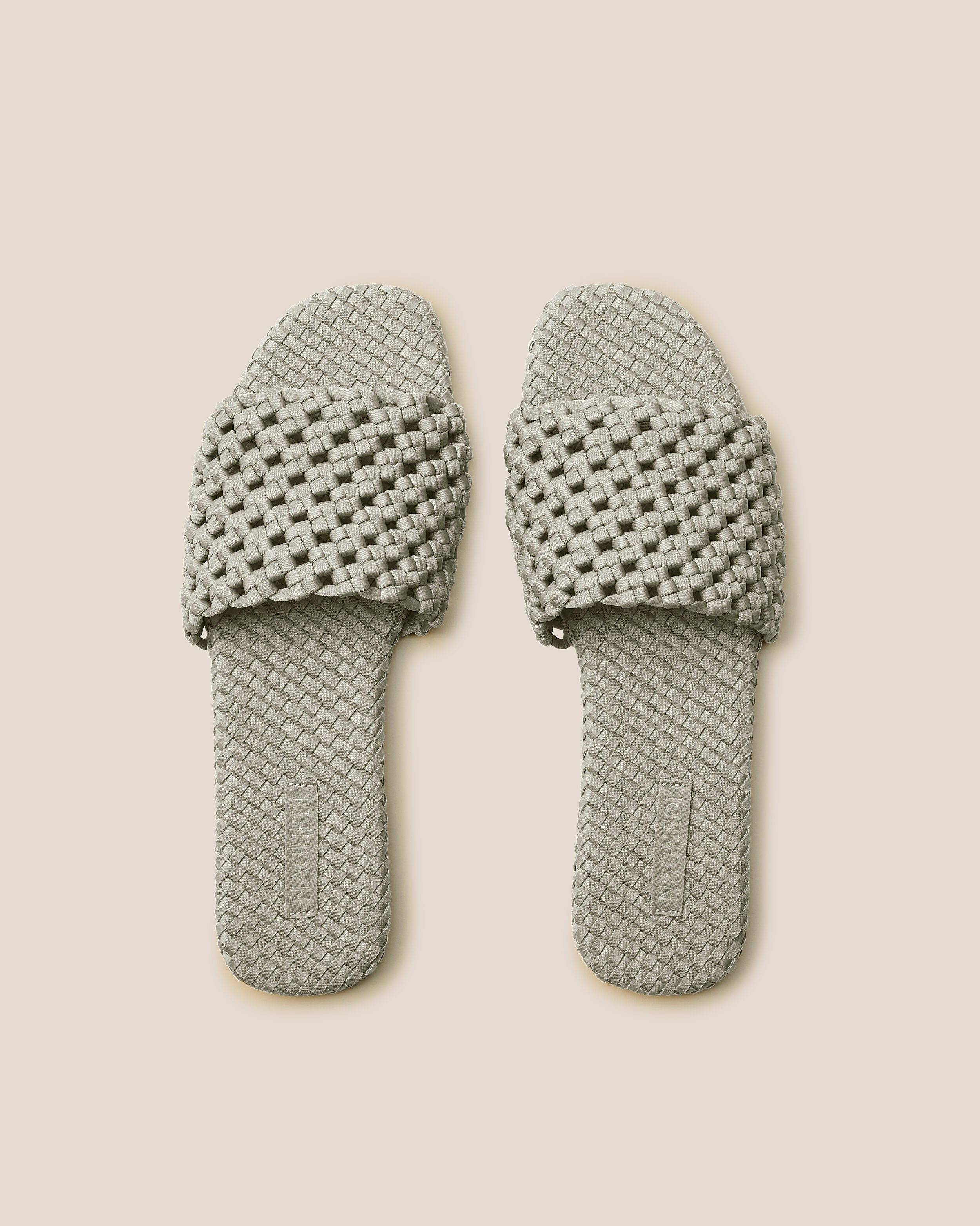 Top view of pair of The Ojai Slide in Celadon showing the handwoven neoprene insole.