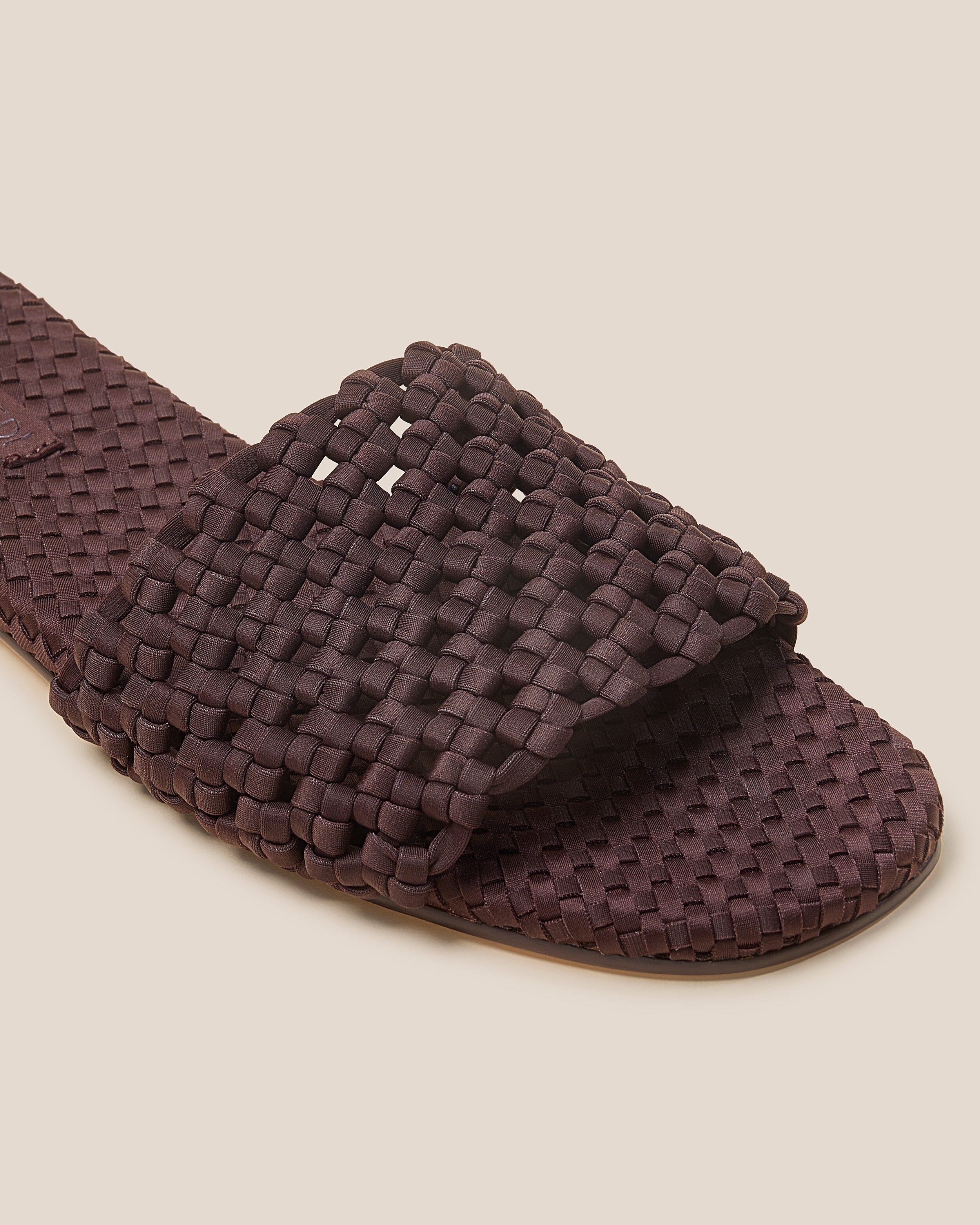 Close-up of The Ojai Slide in Chocolate showing its open toe and round silhouette.