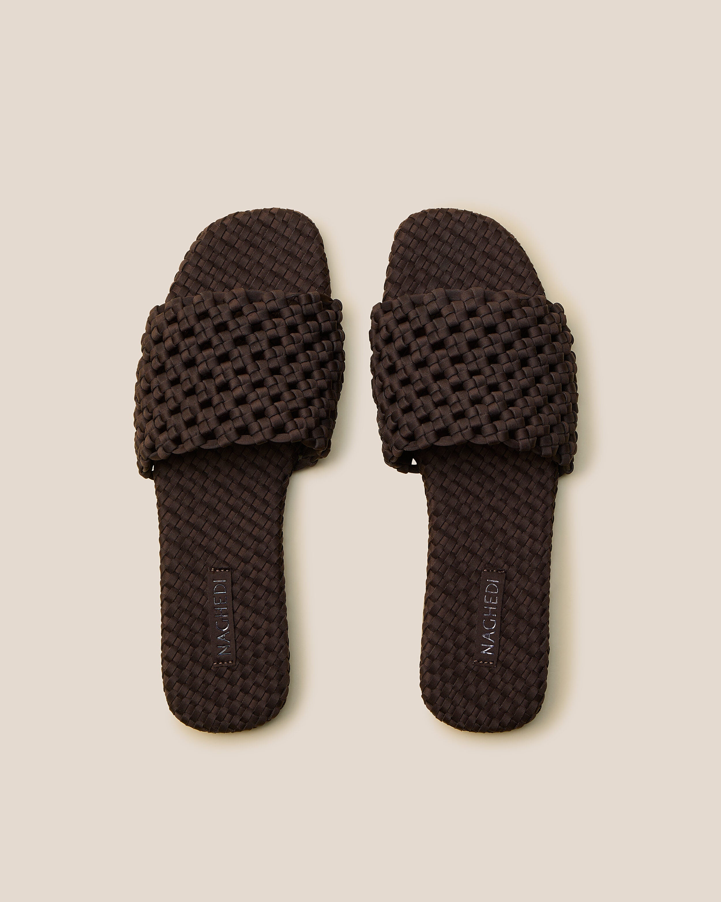 Top view of pair of The Ojai Slide in Chocolate showing the handwoven neoprene insole.