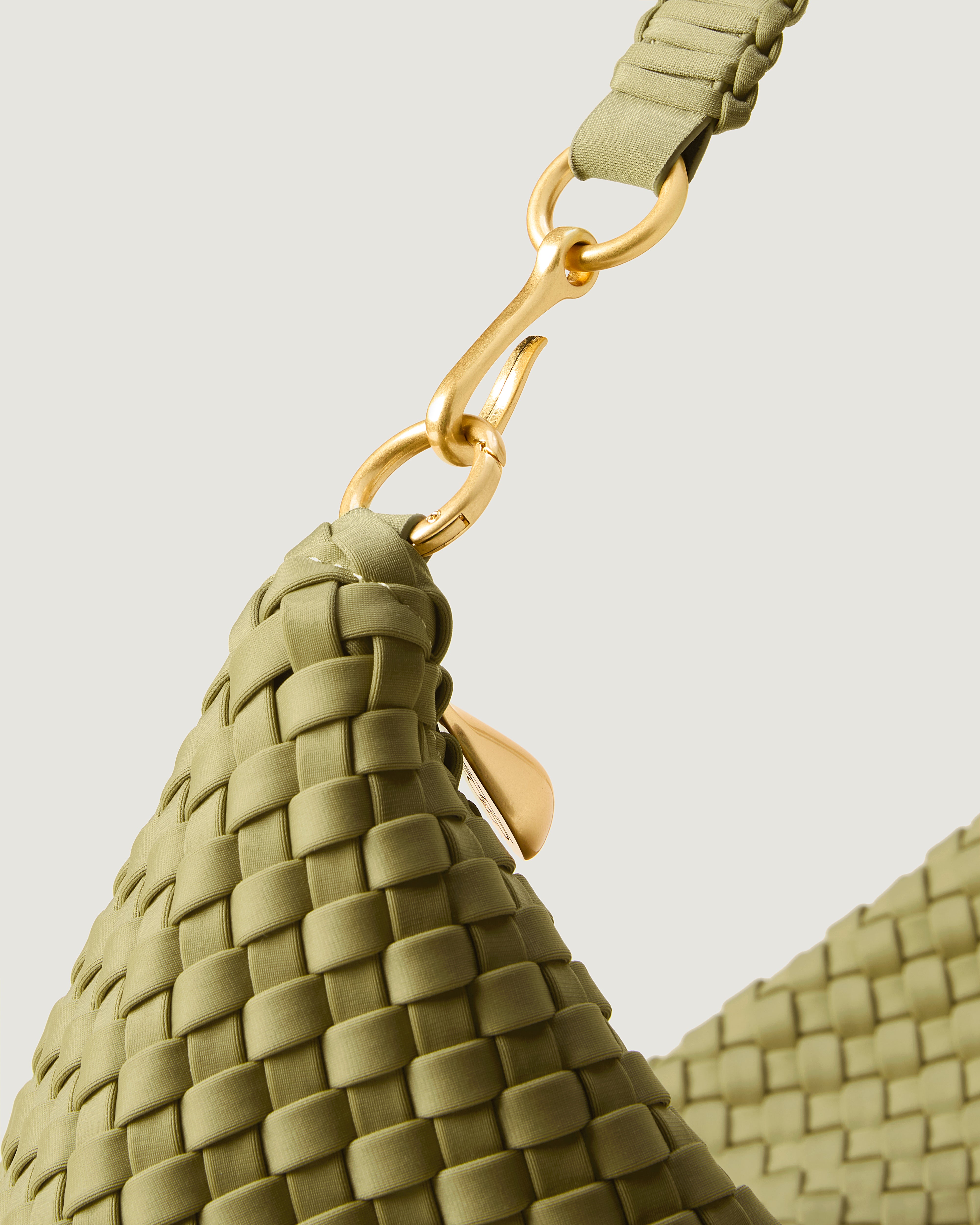 Close-up of zip closure and custom strap hardware.