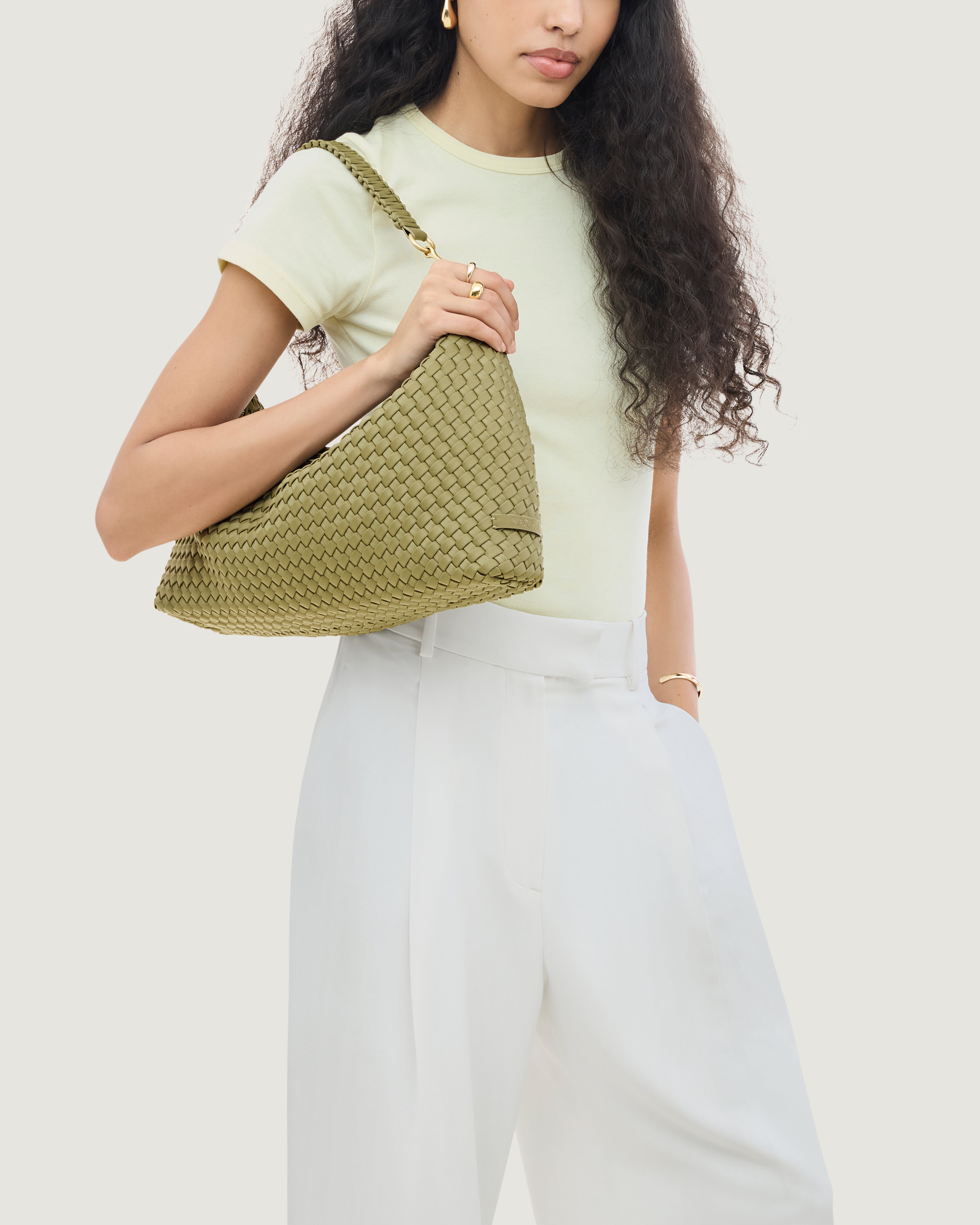 Porto Half-Moon in Bottle Green shown on model to illustrate scale and soft silhouette.