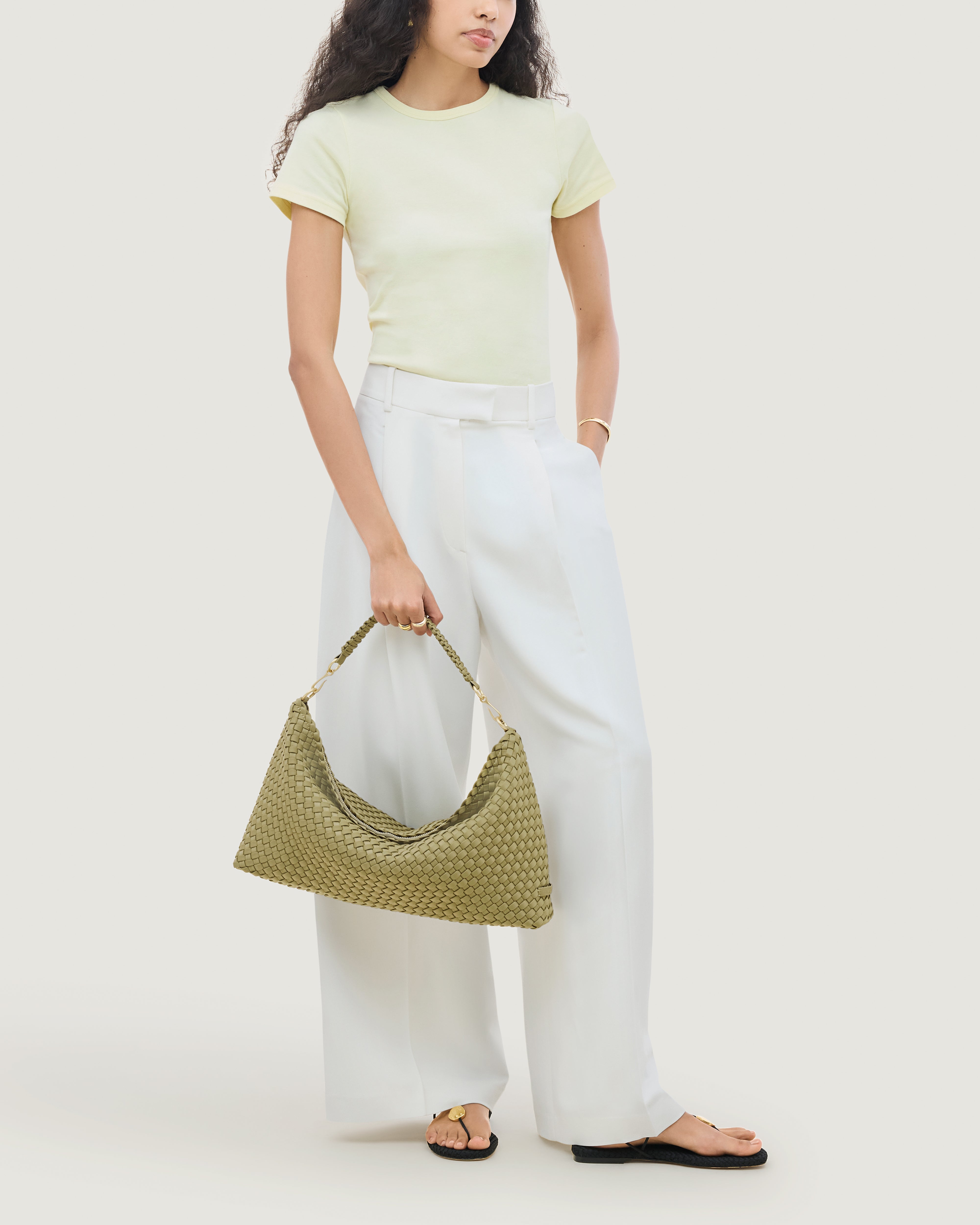 Porto Half-Moon in Bottle Green shown on model to illustrate scale and soft silhouette.