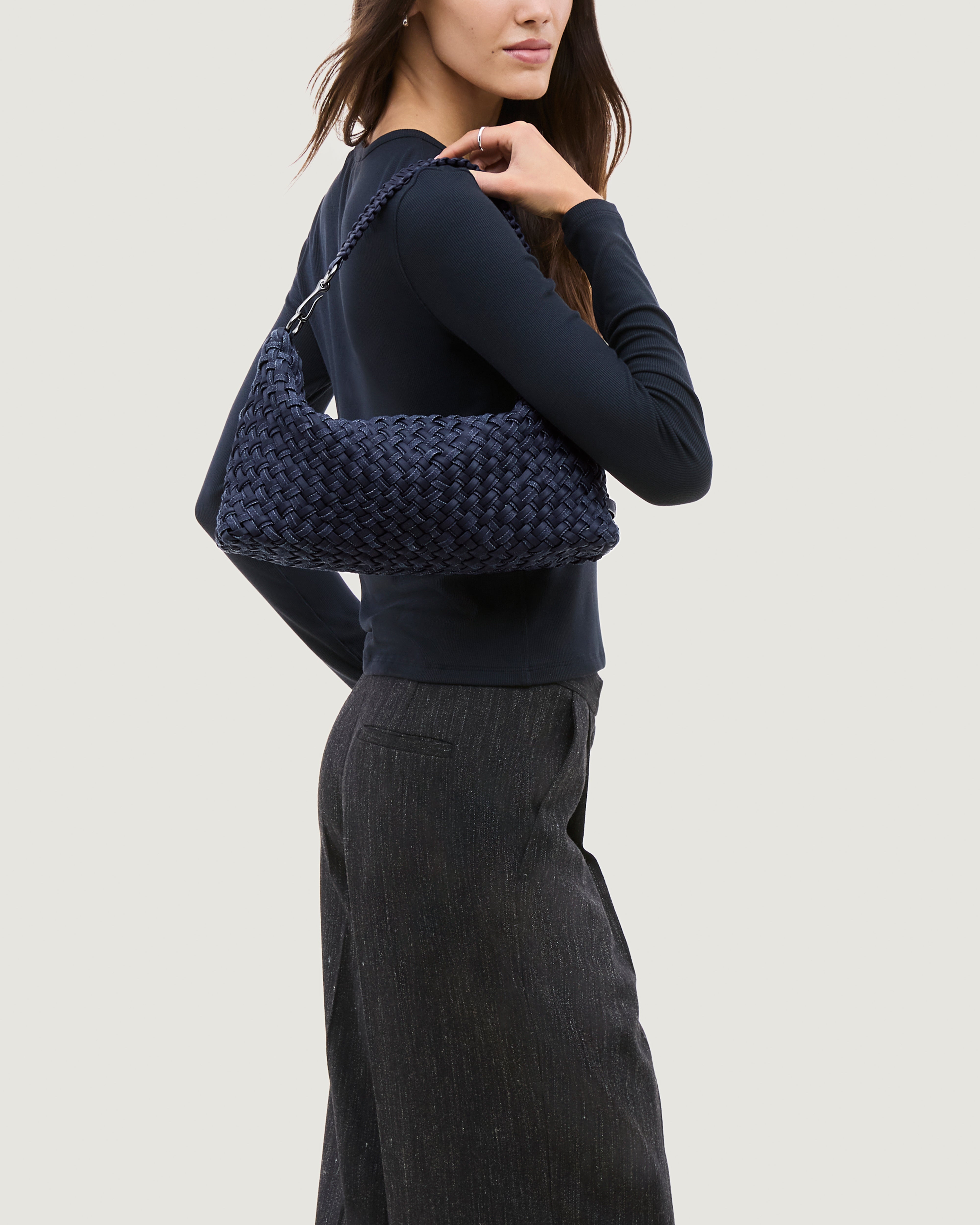 Porto Half-Moon in Indigo shown on model to illustrate scale and soft silhouette.