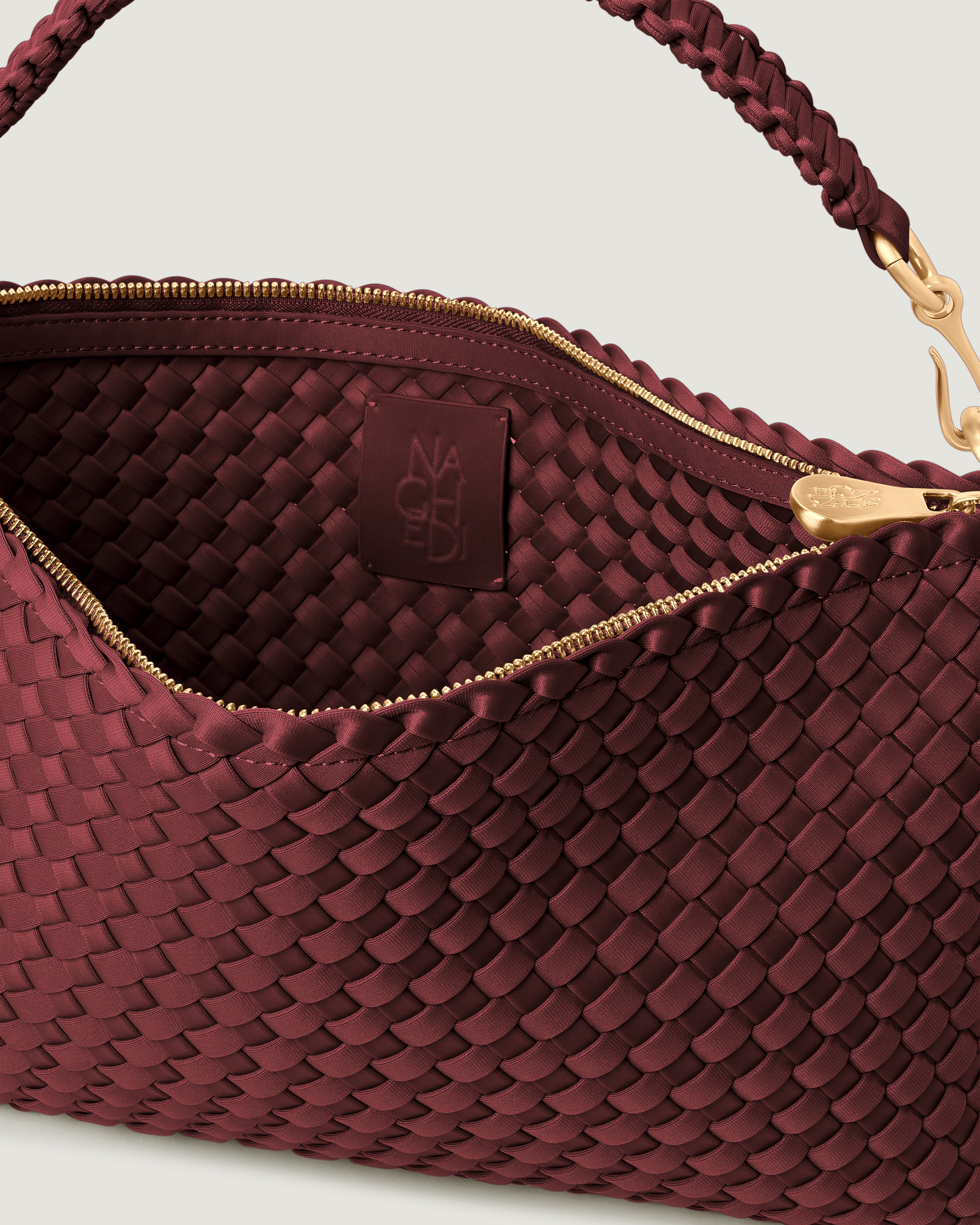 Interior close-up of Porto Half-Moon in Bordeaux showing its zip closure, and unlined interior.