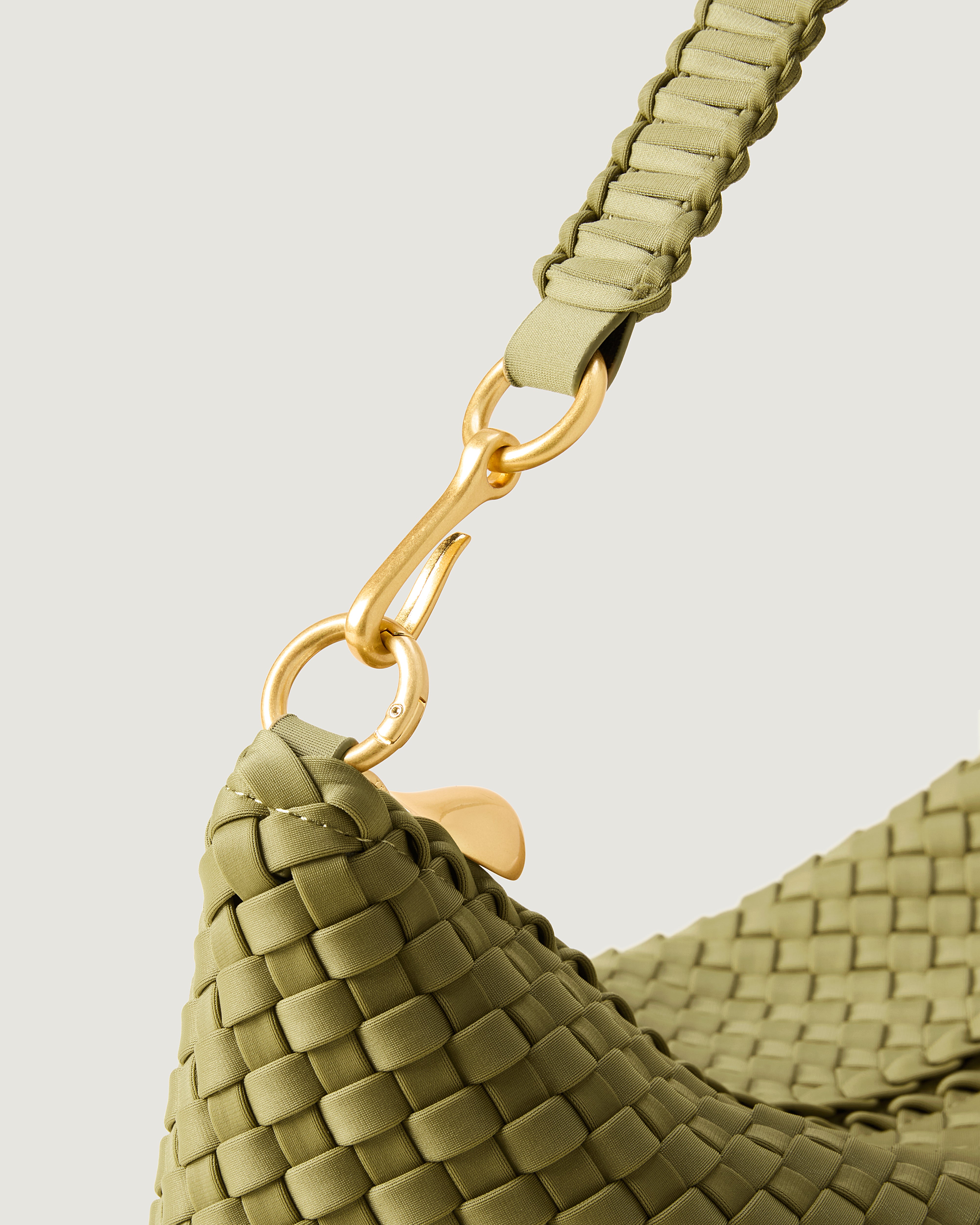 Close-up of zip closure and custom strap hardware.