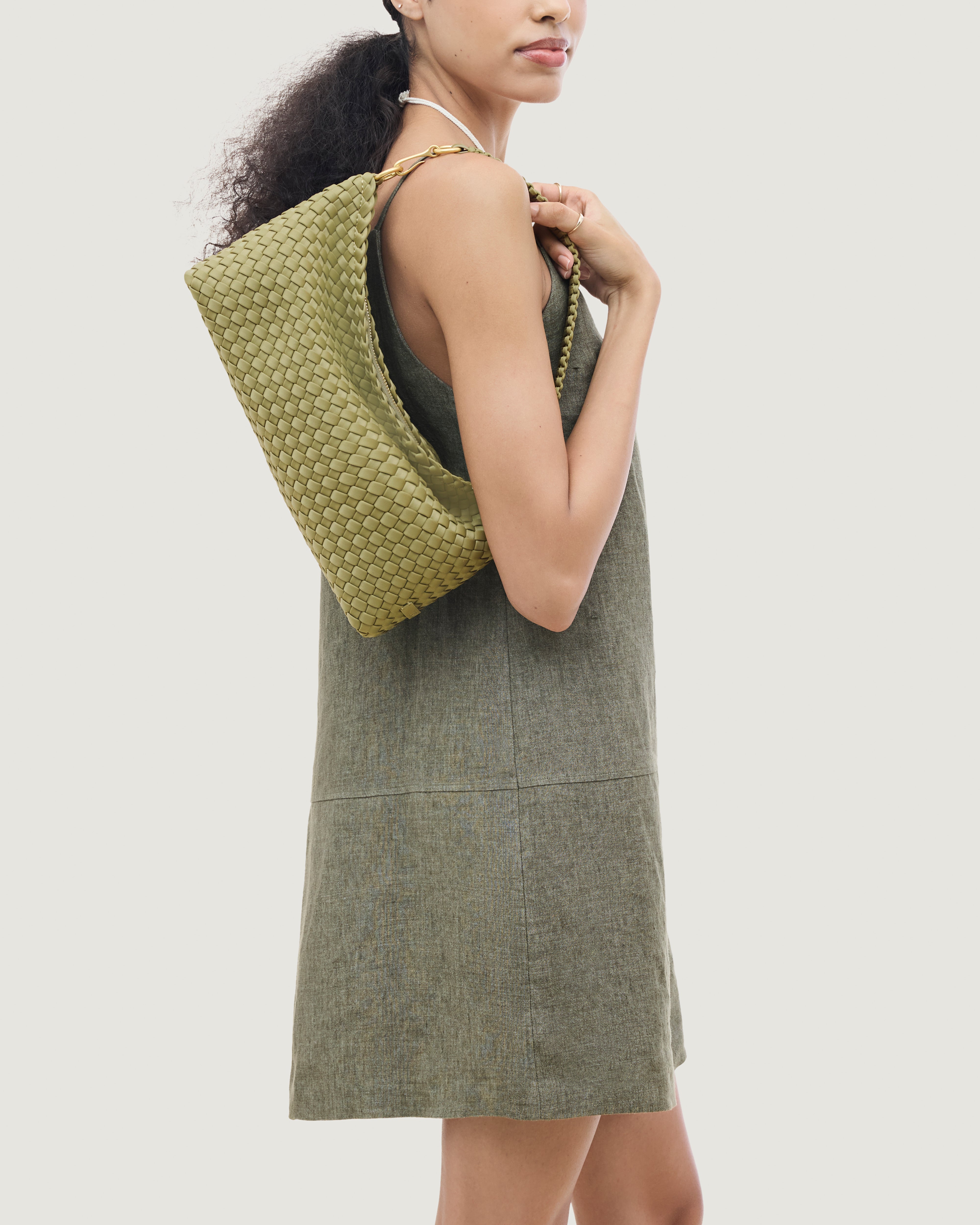 Porto Half-Moon in Bottle Green shown on model to illustrate scale and soft silhouette.
