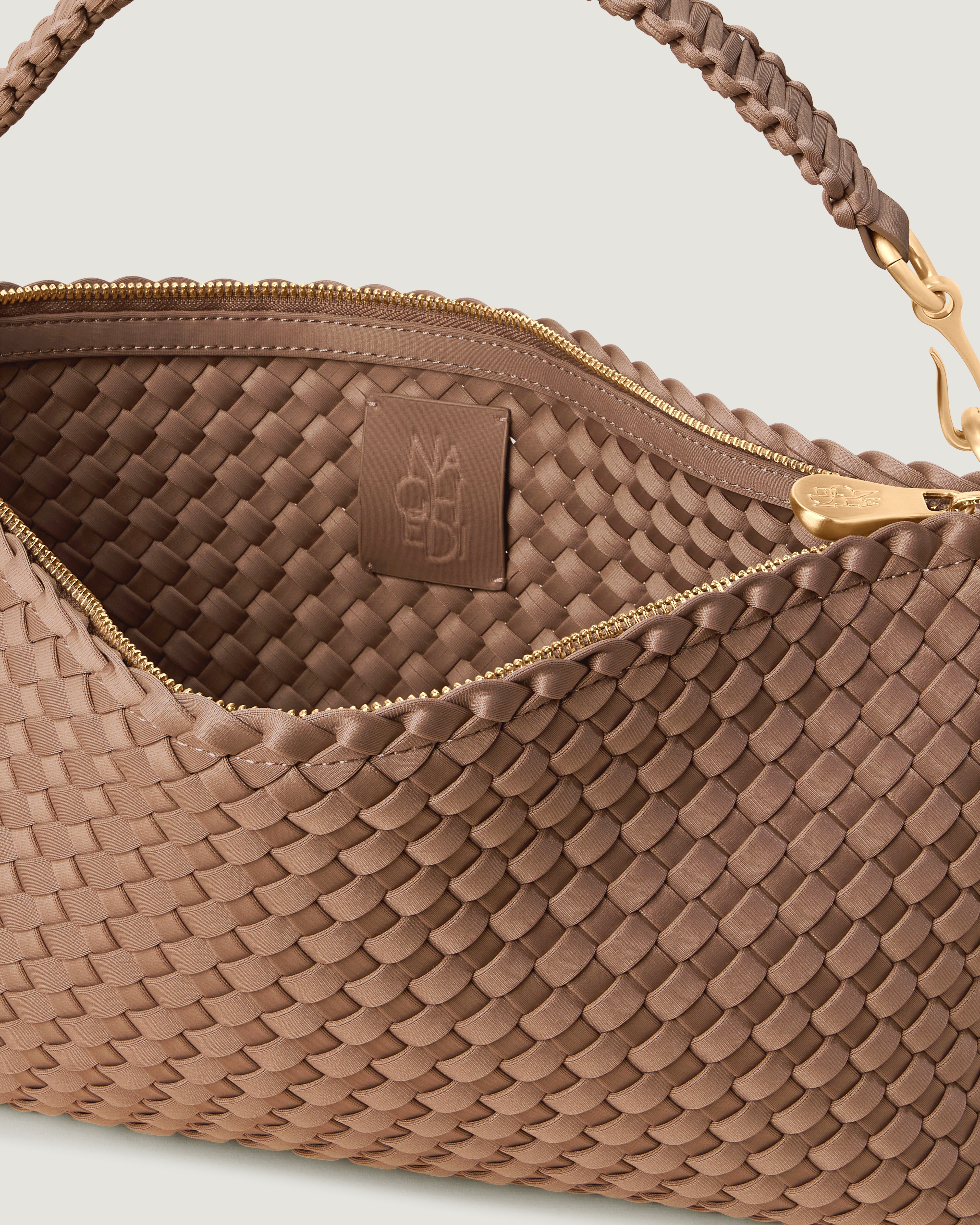 Interior close-up of Porto Half-Moon in Seychelles showing its zip closure, and unlined interior.