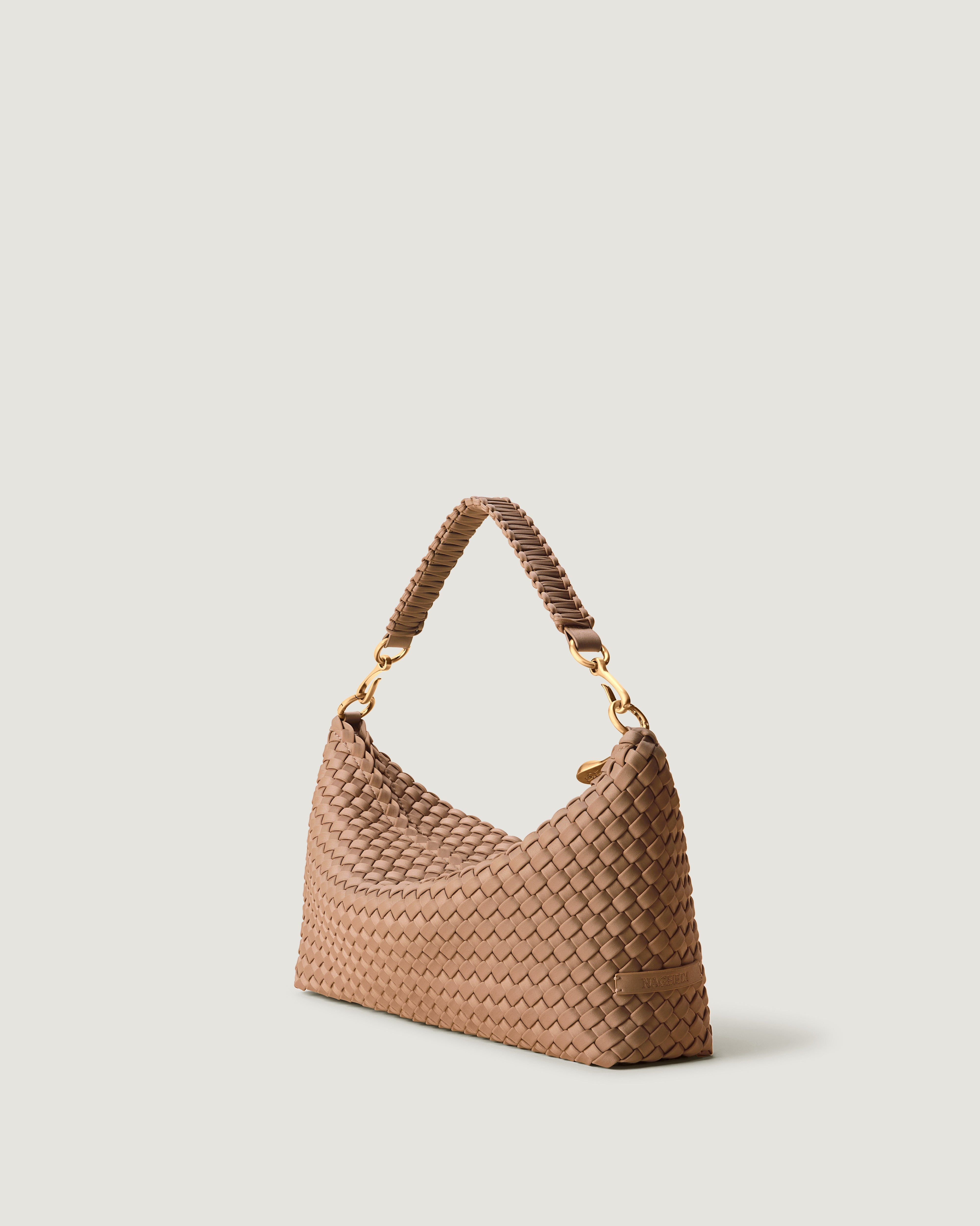 Porto Half-Moon in Seychelles shown from a side angle, highlighting its handwoven neoprene construction and zip closure.