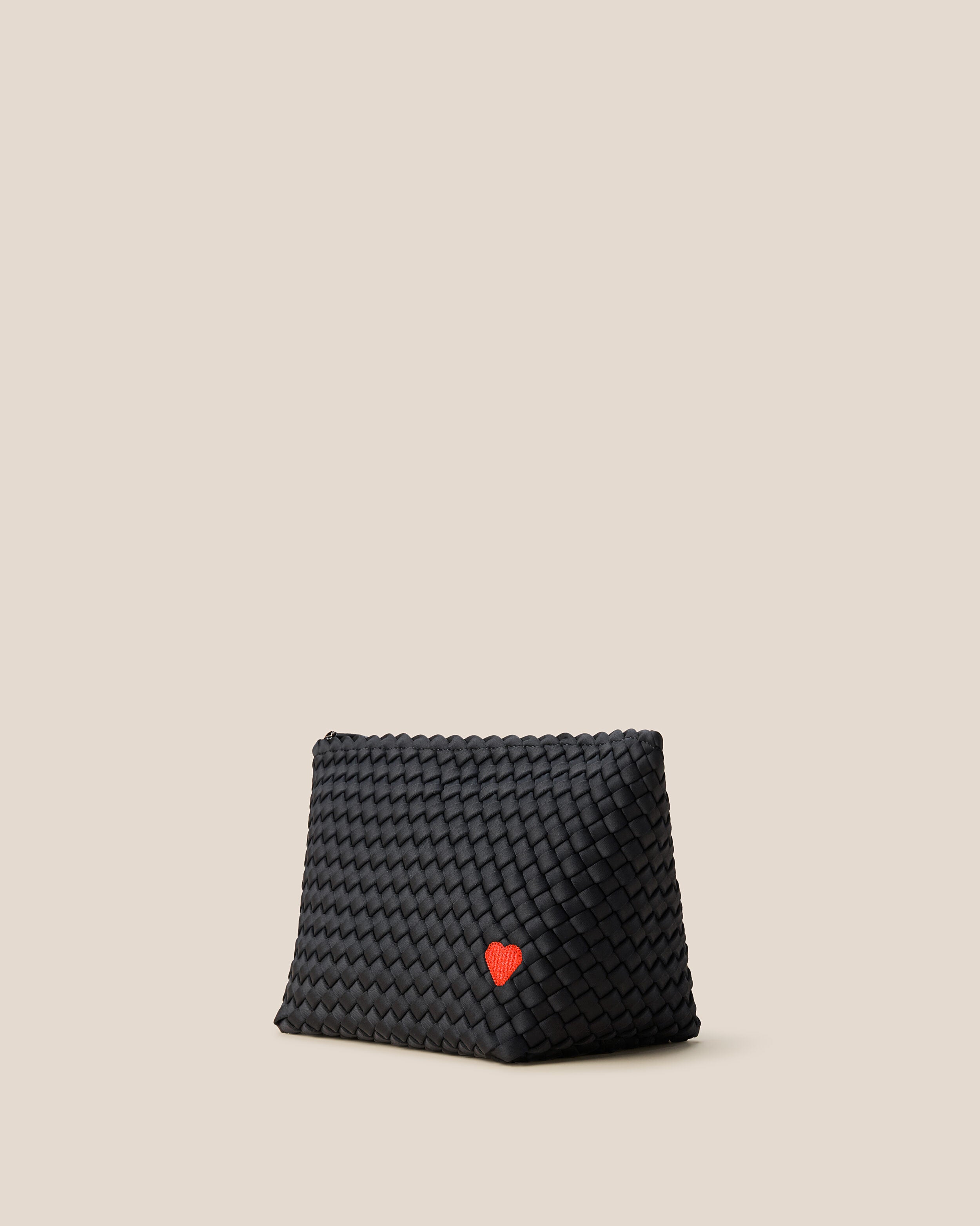 Portofino Cosmetic Pouch in Onyx shown from a side angle, highlighting its handwoven neoprene construction and zip closure.