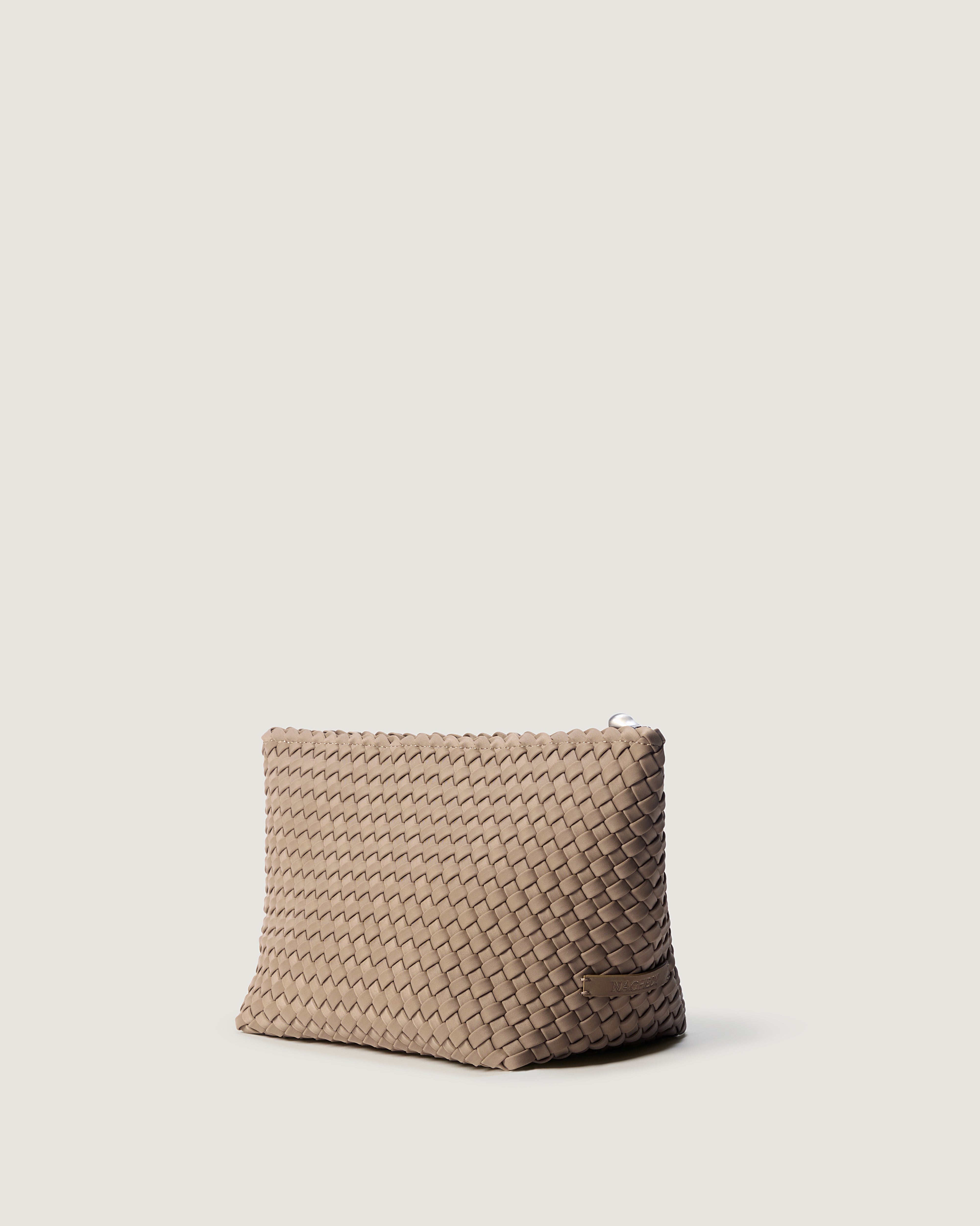 Portofino Cosmetic Pouch in Cashmere shown from a side angle, highlighting its handwoven neoprene construction and zip closure.