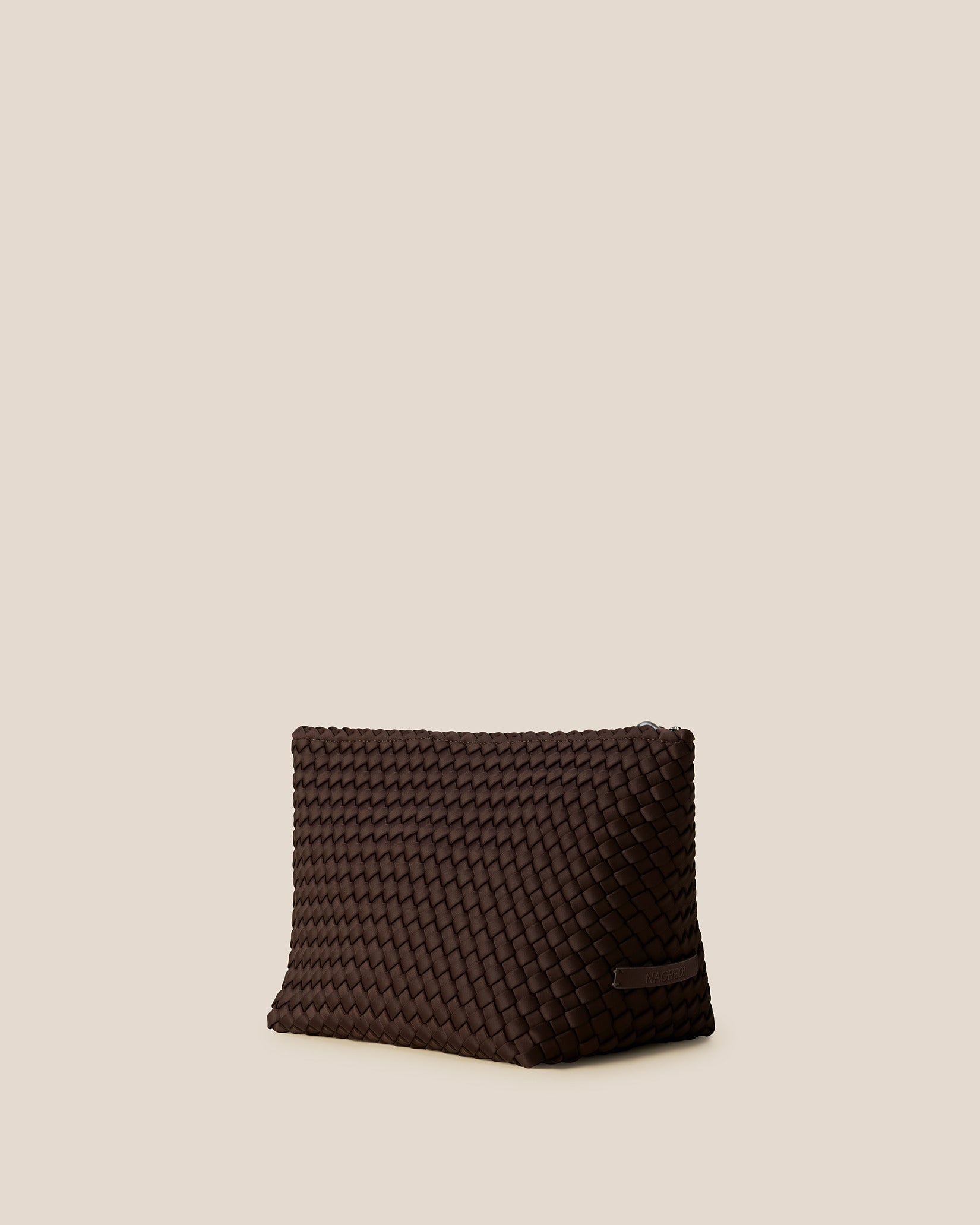Portofino Large Cosmetic Pouch in Chocolate shown from a side angle, highlighting its handwoven neoprene and zip closure.