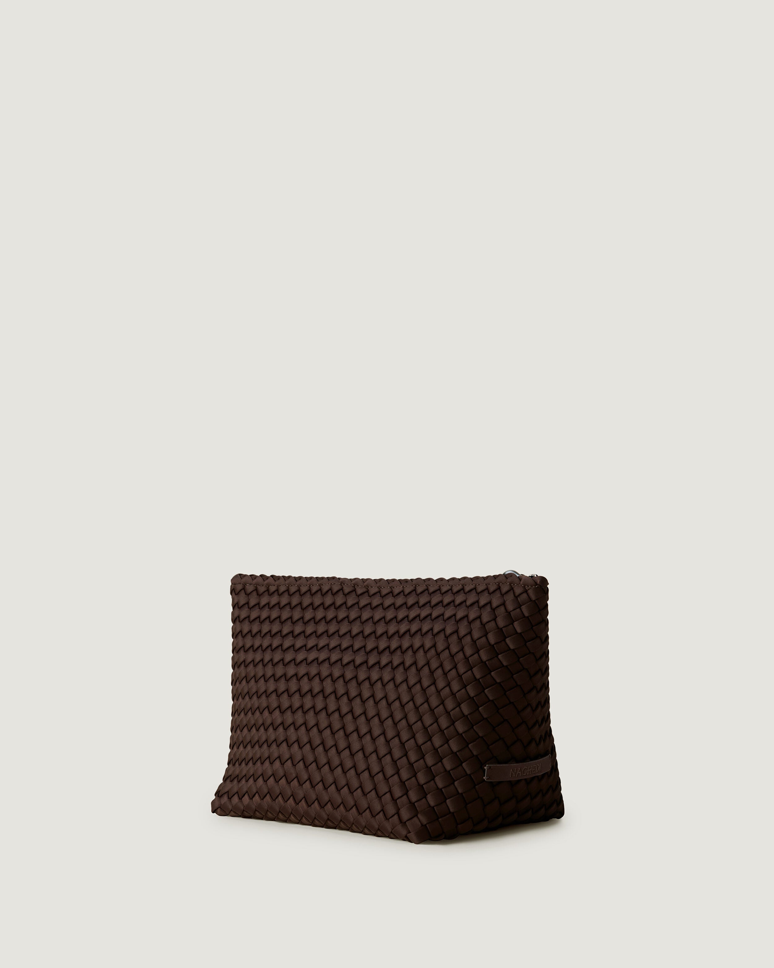 Portofino Cosmetic Pouch in Chocolate shown from a side angle, highlighting its handwoven neoprene construction and zip closure.