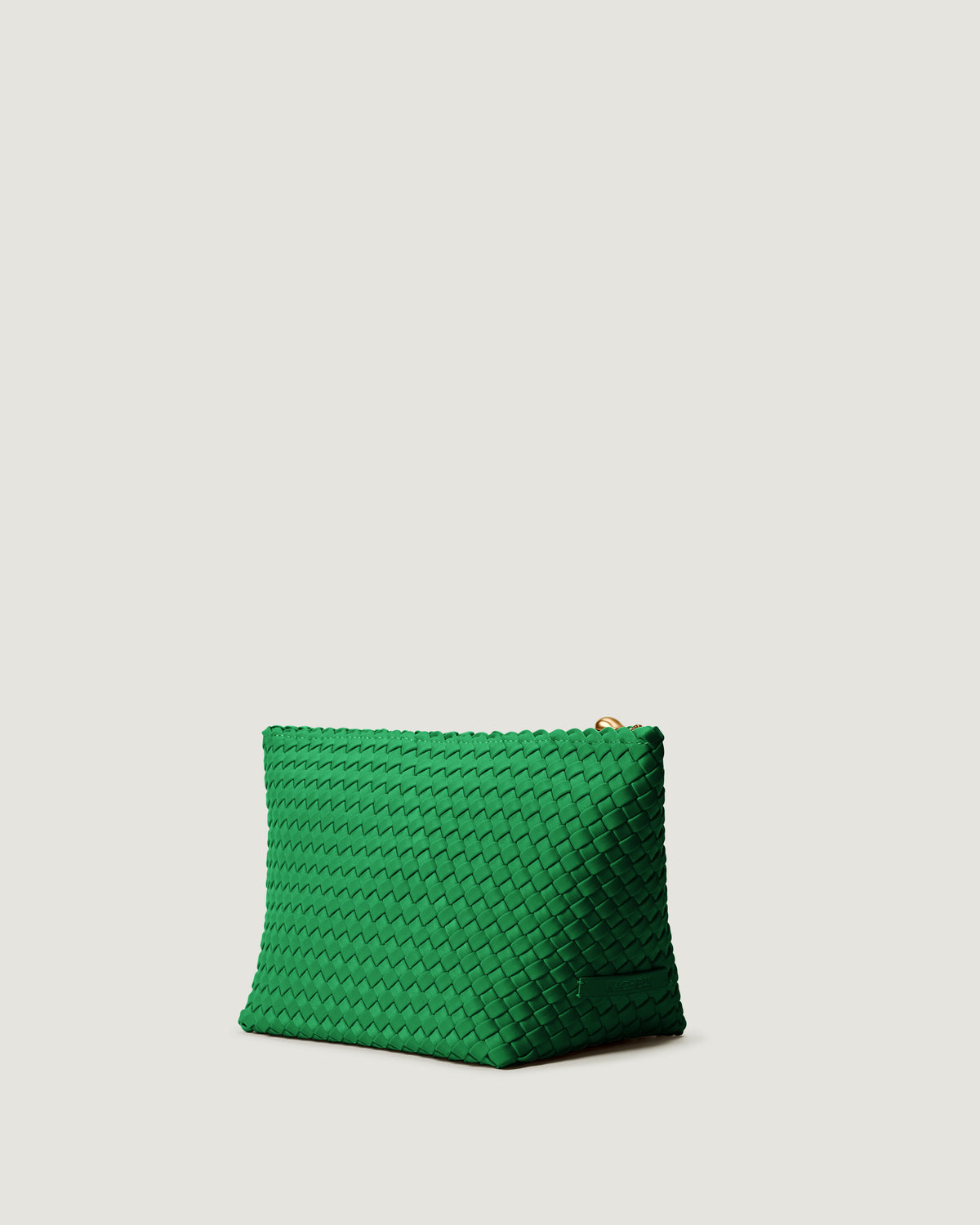 Portofino Cosmetic Pouch in Emerald shown from a side angle, highlighting its handwoven neoprene construction and zip closure.