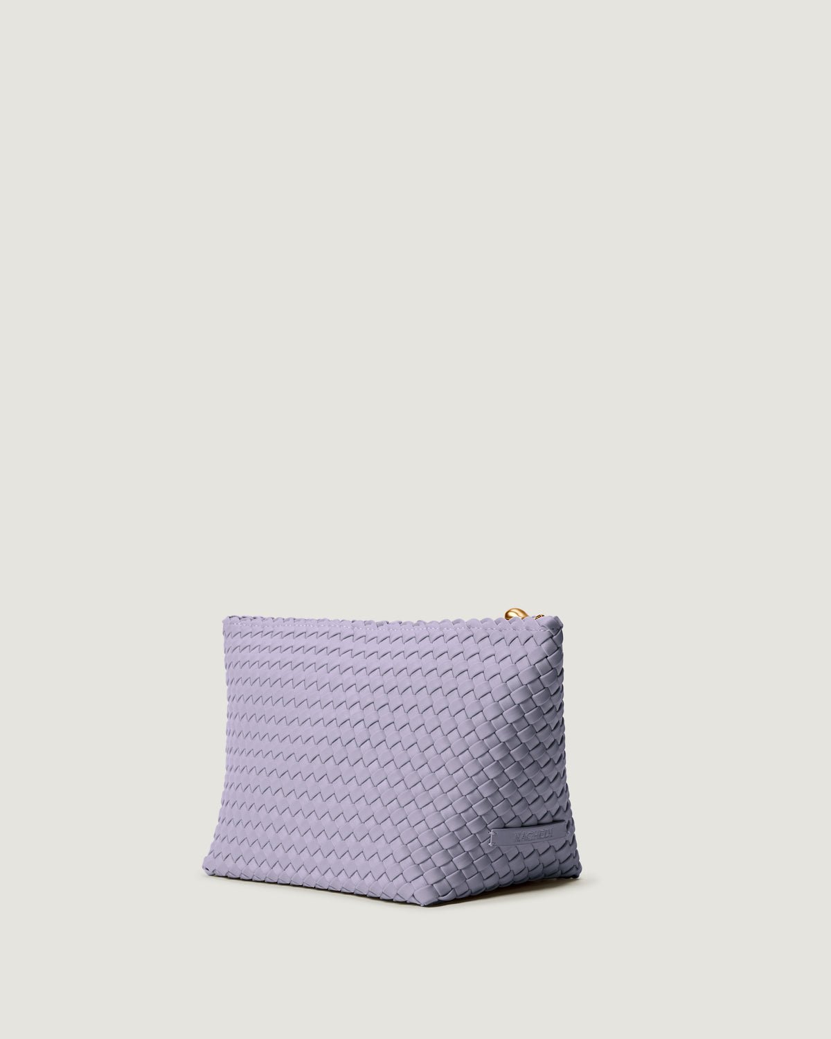 Portofino Cosmetic Pouch in Lilac shown from a side angle, highlighting its handwoven neoprene construction and zip closure.