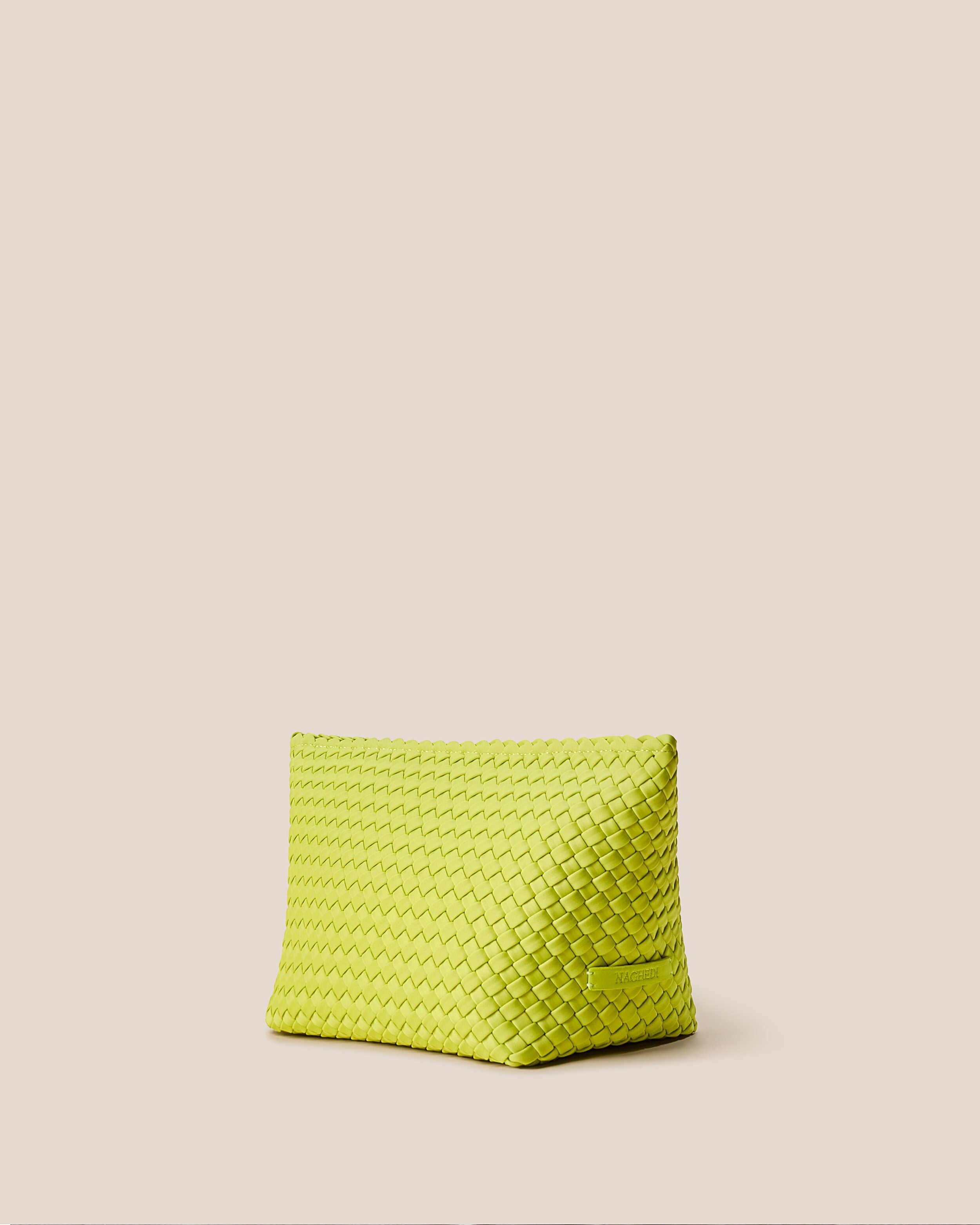 Portofino Cosmetic Pouch in Matcha shown from a side angle, highlighting its handwoven neoprene construction and zip closure.
