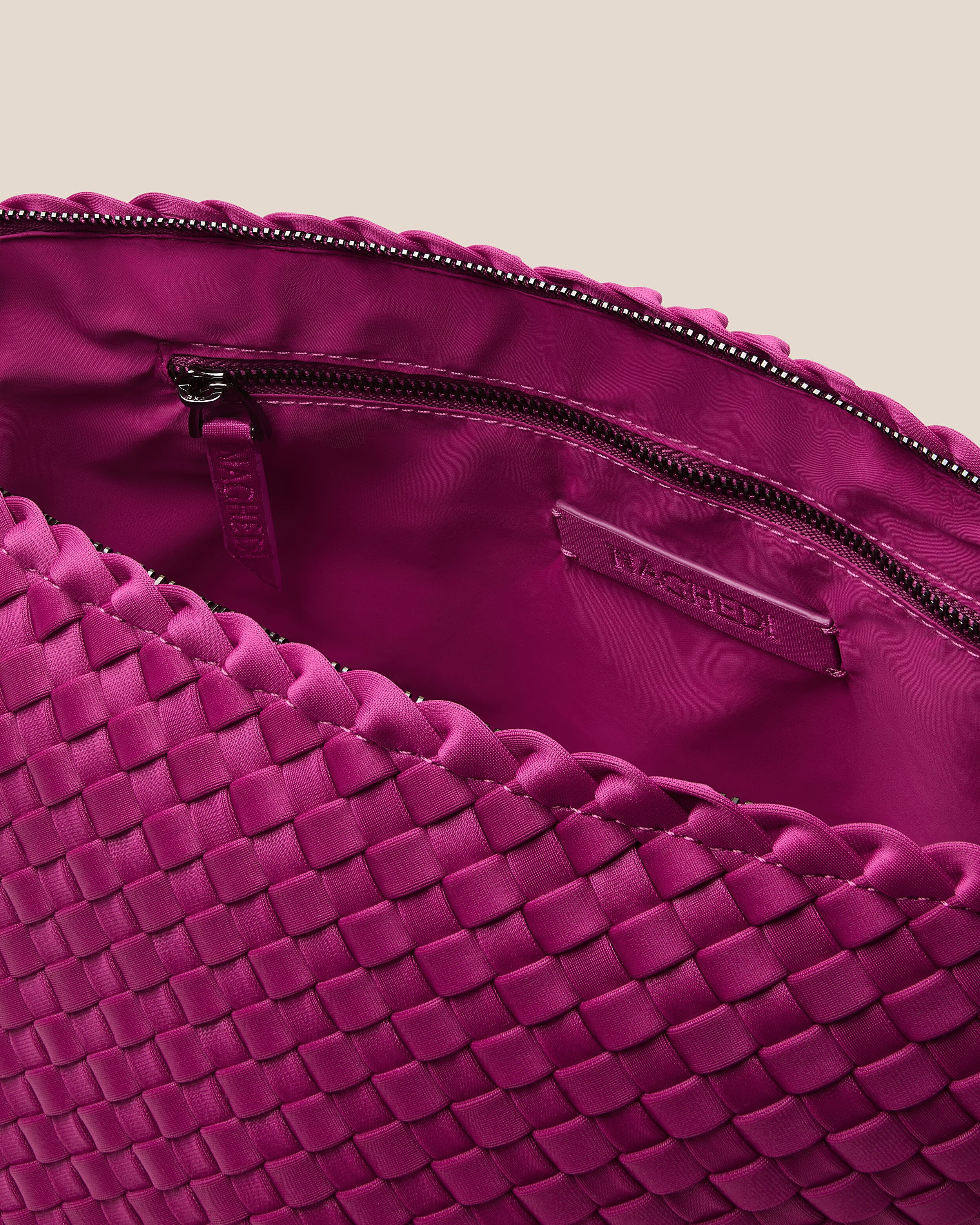 Interior close-up of Portofino Cosmetic Pouch in Rio showing its zip closure, interior pockets, and wipe-clean nylon interior.