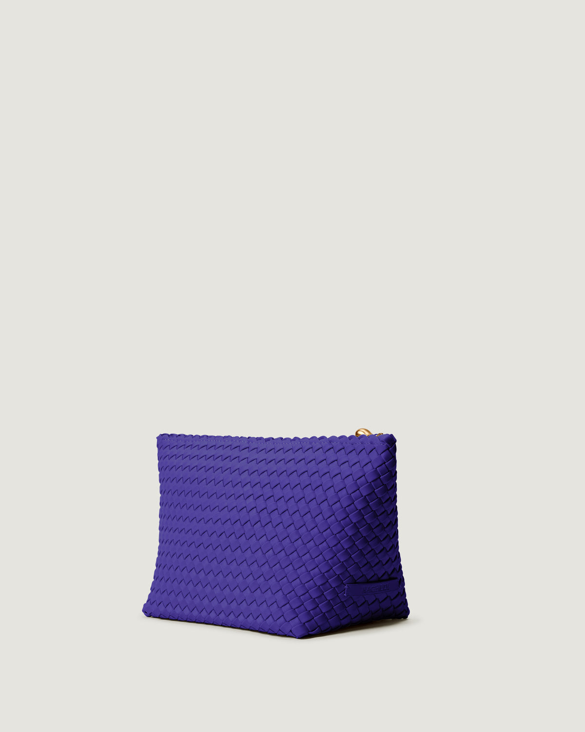 Portofino Cosmetic Pouch in Ultramarine shown from a side angle, highlighting its handwoven neoprene construction and zip closure.