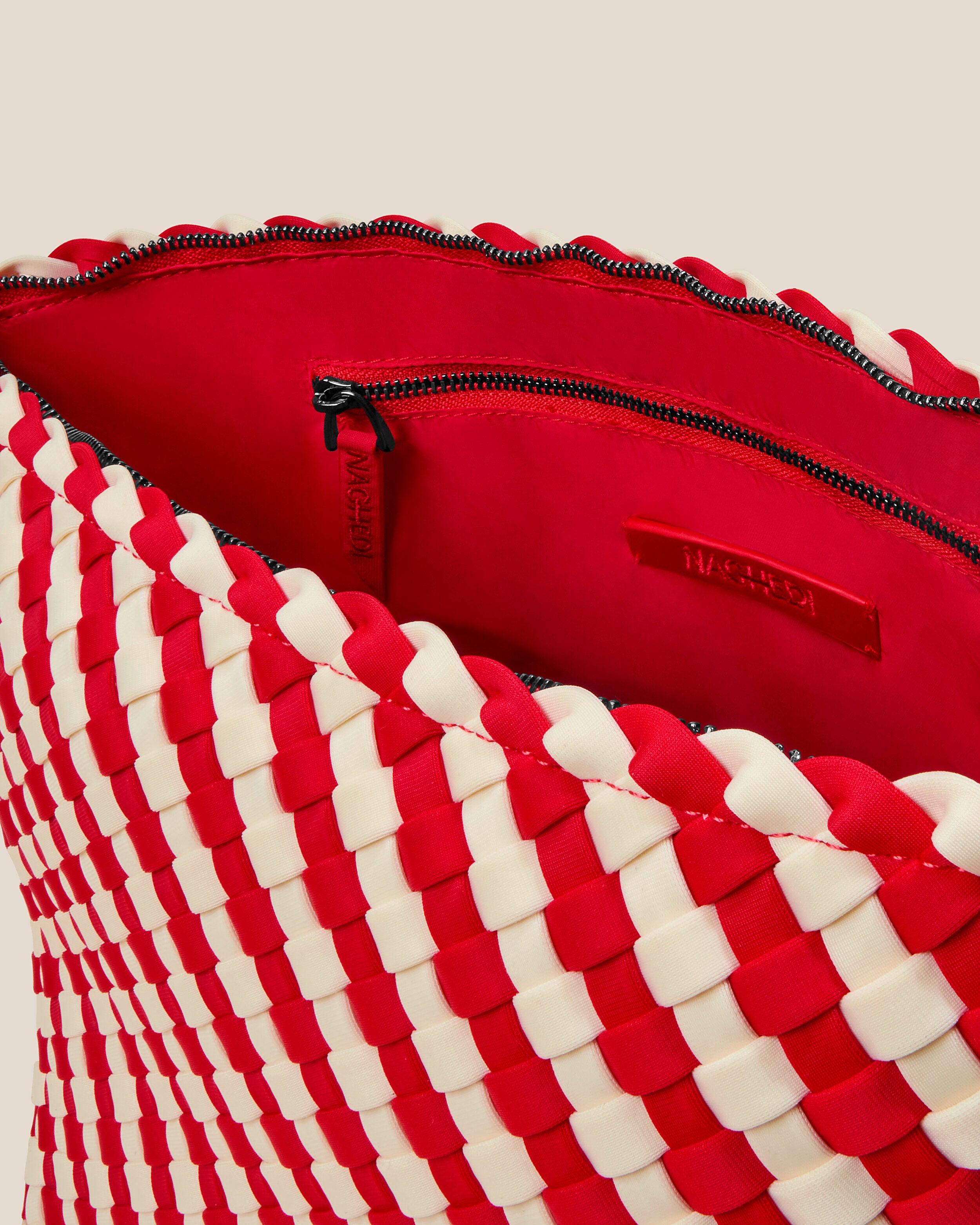 Interior close-up of Portofino Cosmetic Pouch in Amalfi showing its zip closure, interior pockets, and wipe-clean nylon interior.