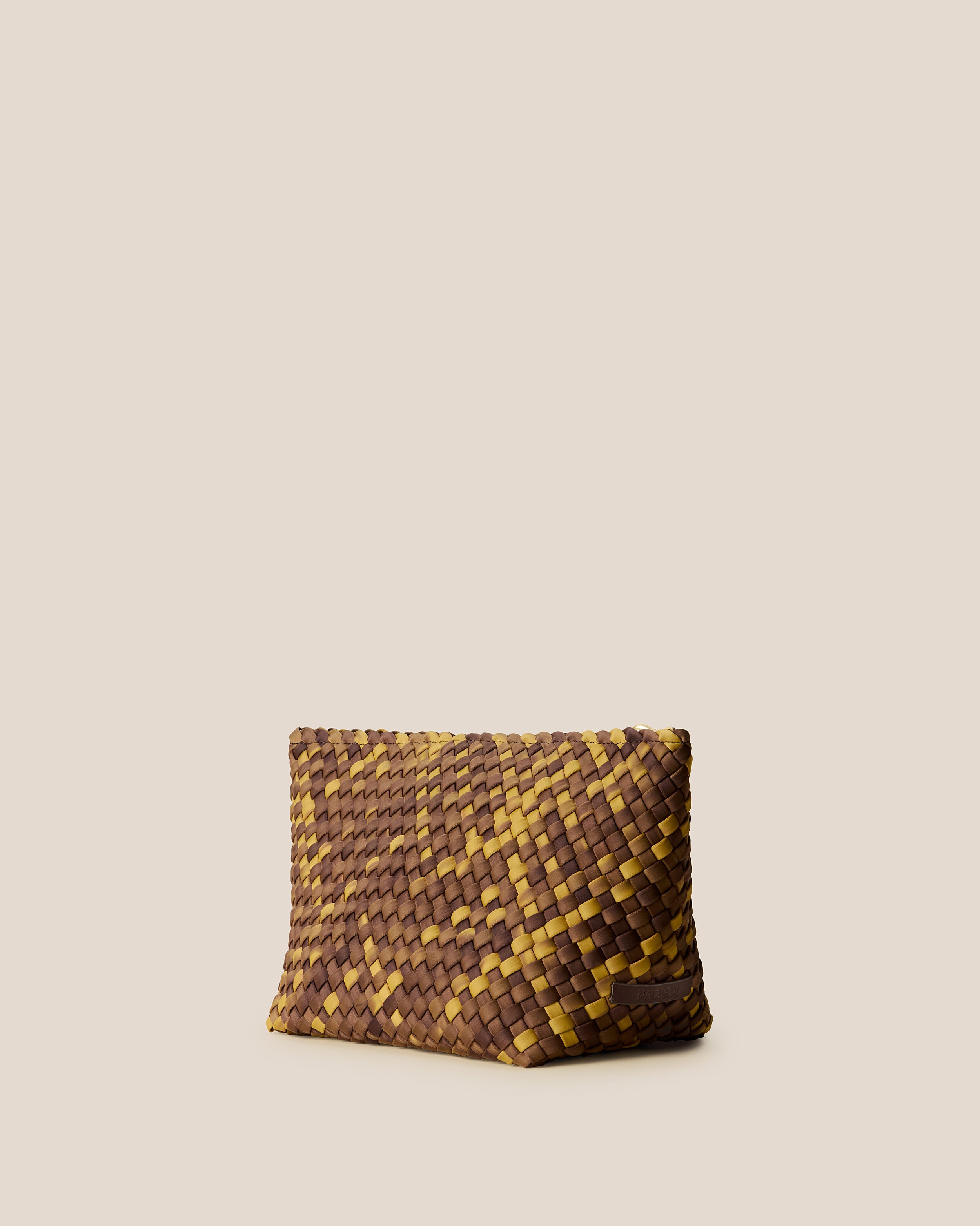 Portofino Cosmetic Pouch in Tortoiseshell shown from a side angle, highlighting its handwoven neoprene construction and zip closure.