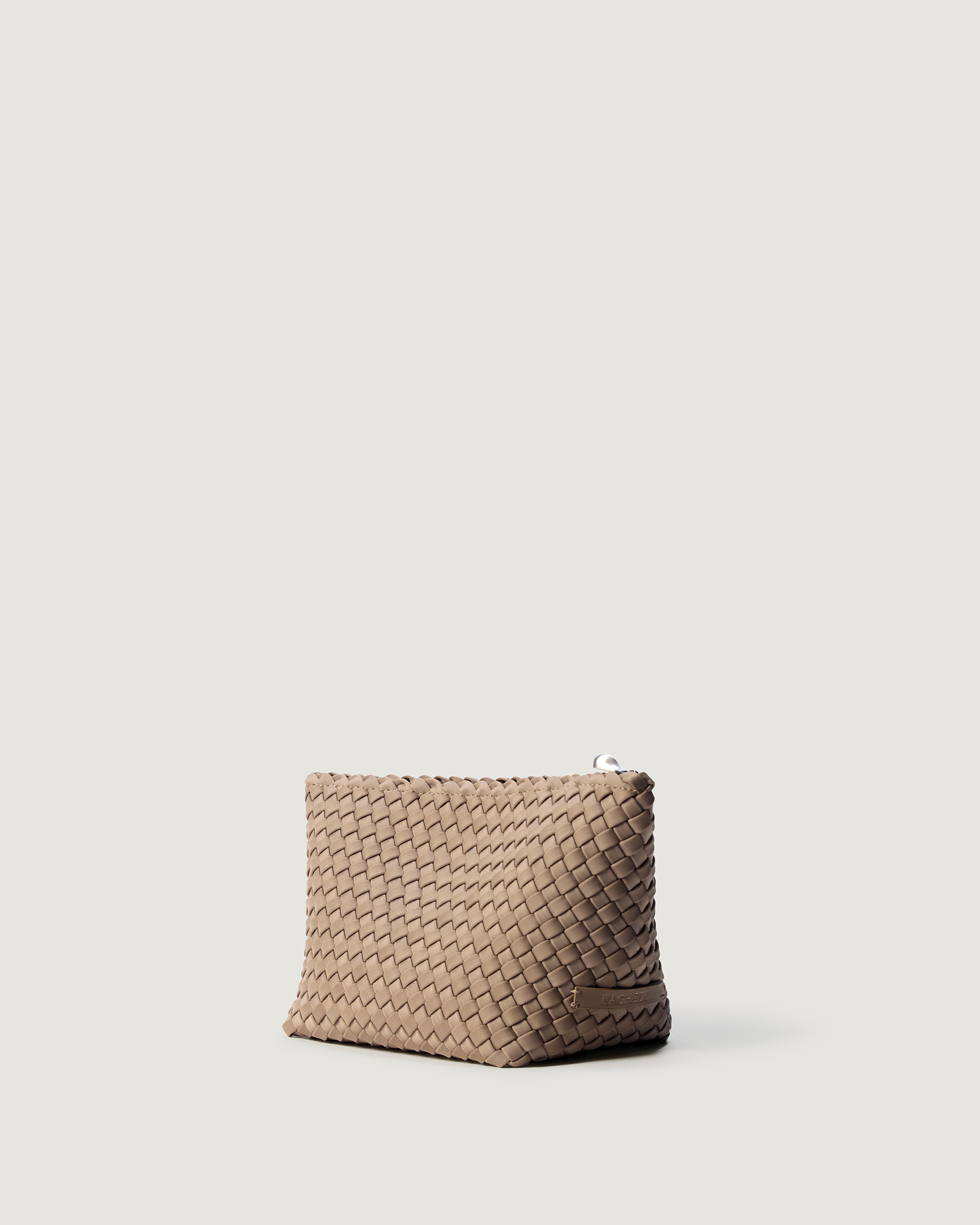 Portofino Cosmetic Pouch in Cashmere shown from a side angle, highlighting its handwoven neoprene construction and zip closure.
