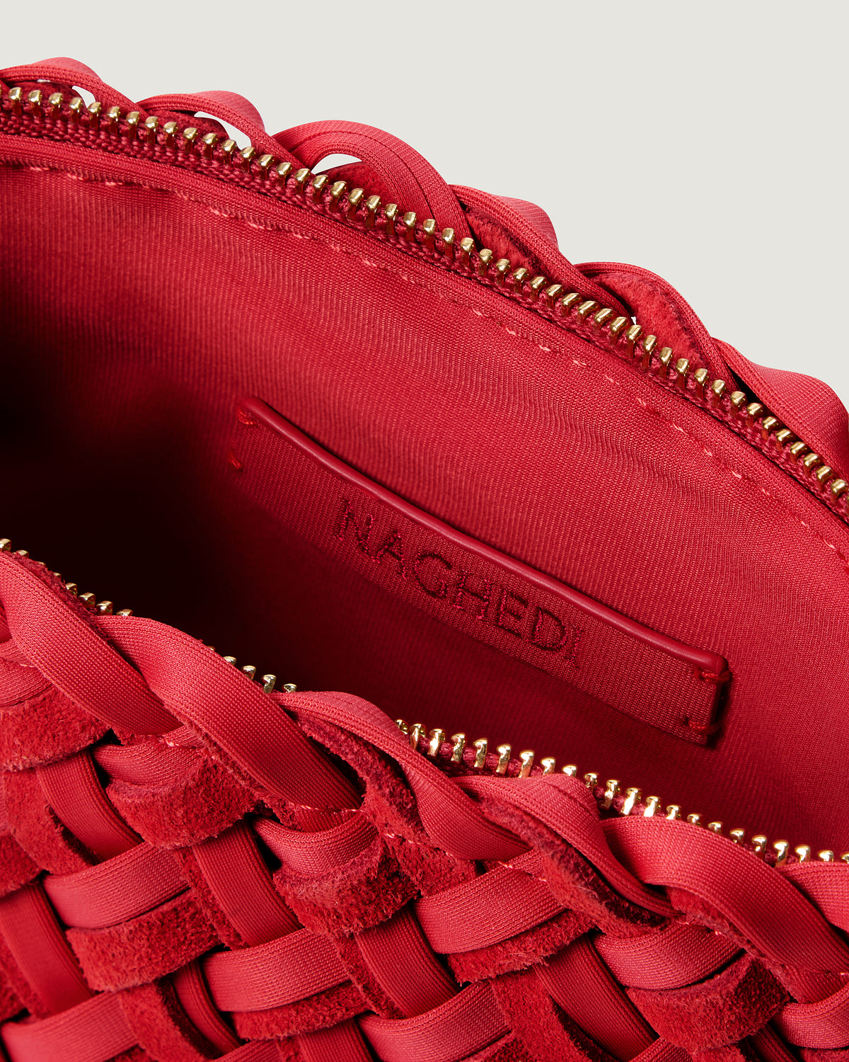 Interior close-up of Portofino Petit Cosmetic Pouch in Cerise showing its zip closure, and wipe-clean nylon interior.