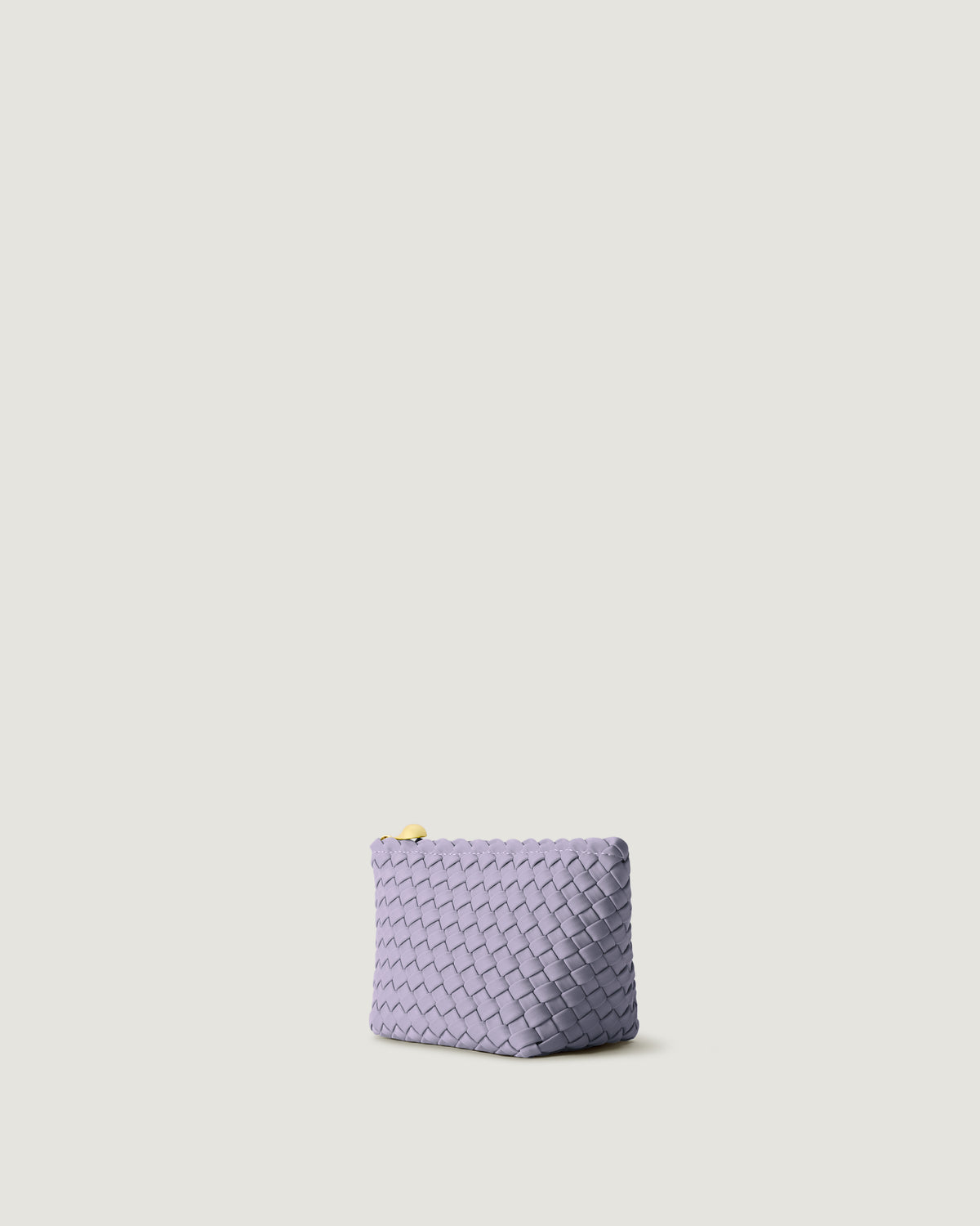 Portofino Cosmetic Pouch in Lilac shown from a side angle, highlighting its handwoven neoprene construction and zip closure.