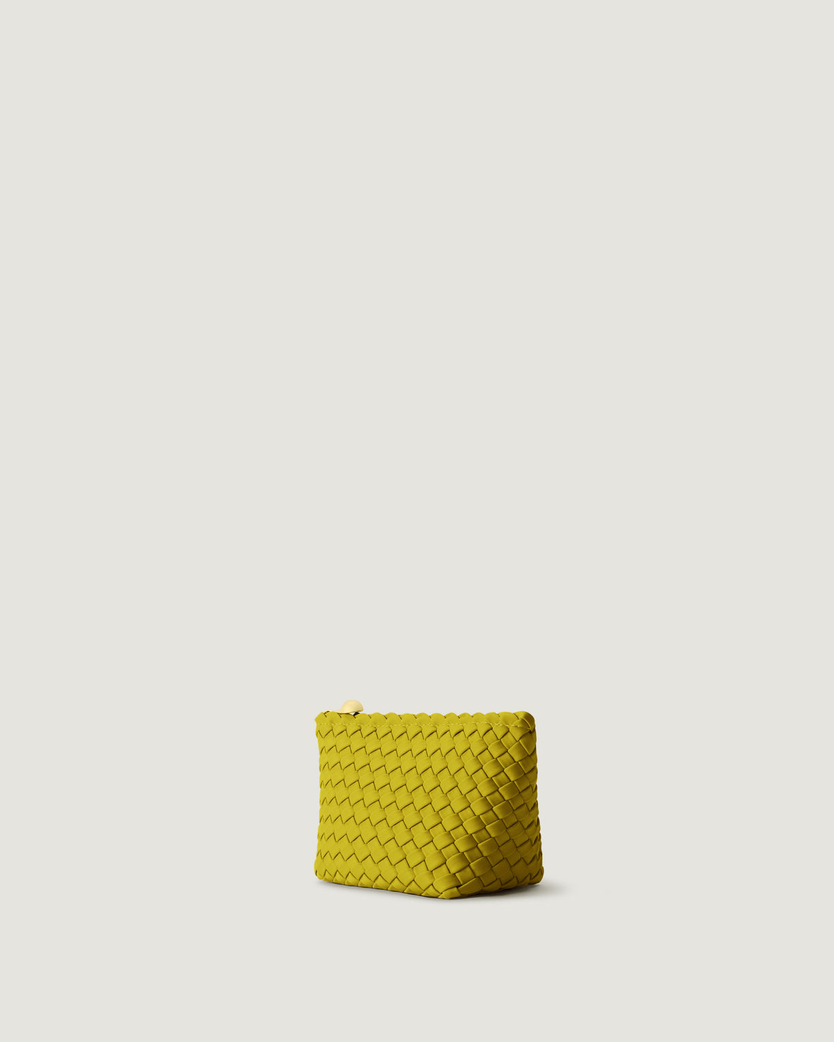 Portofino Cosmetic Pouch in Ochre shown from a side angle, highlighting its handwoven neoprene construction and zip closure.