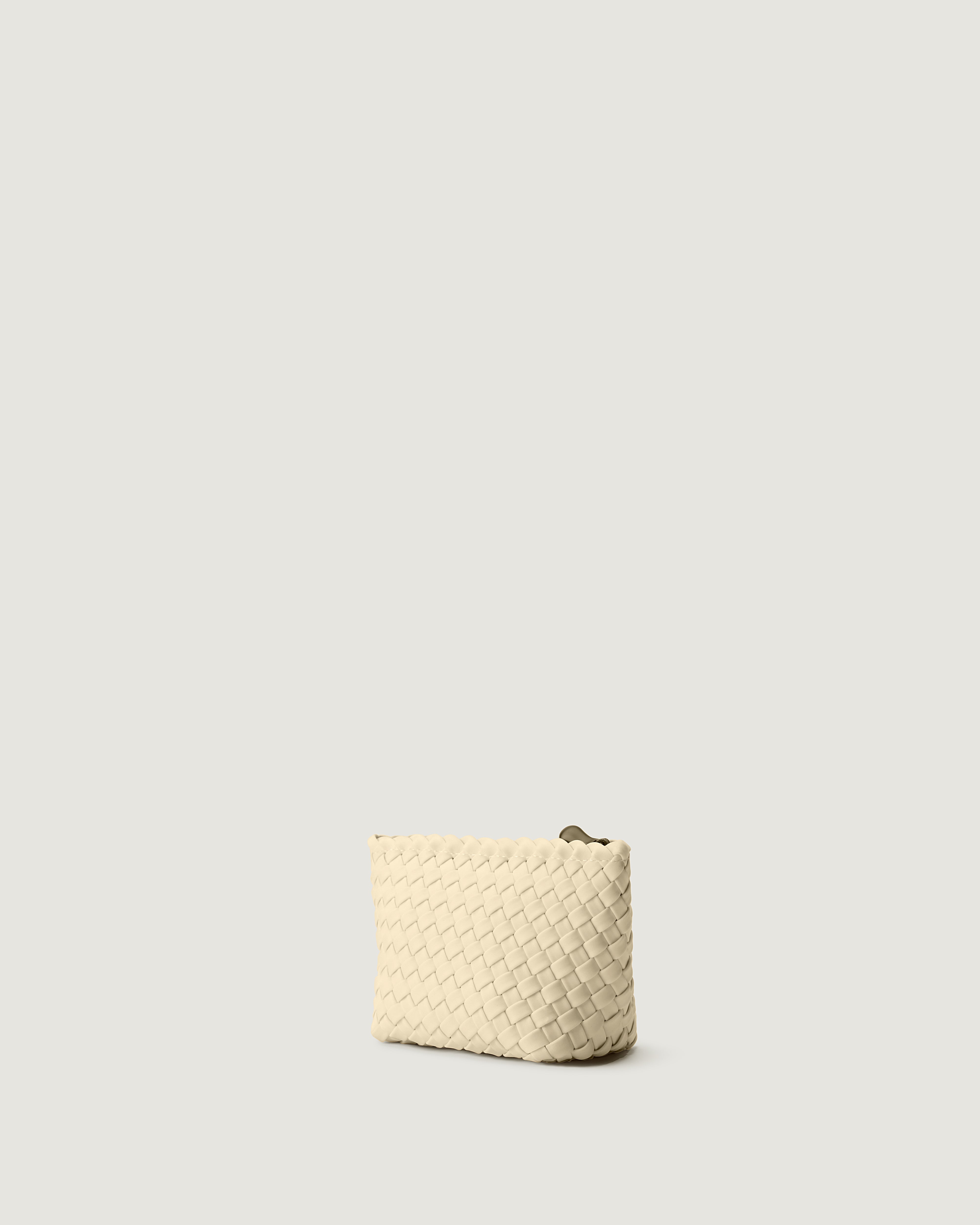 Portofino Cosmetic Pouch in Salt shown from a side angle, highlighting its handwoven neoprene construction and zip closure.