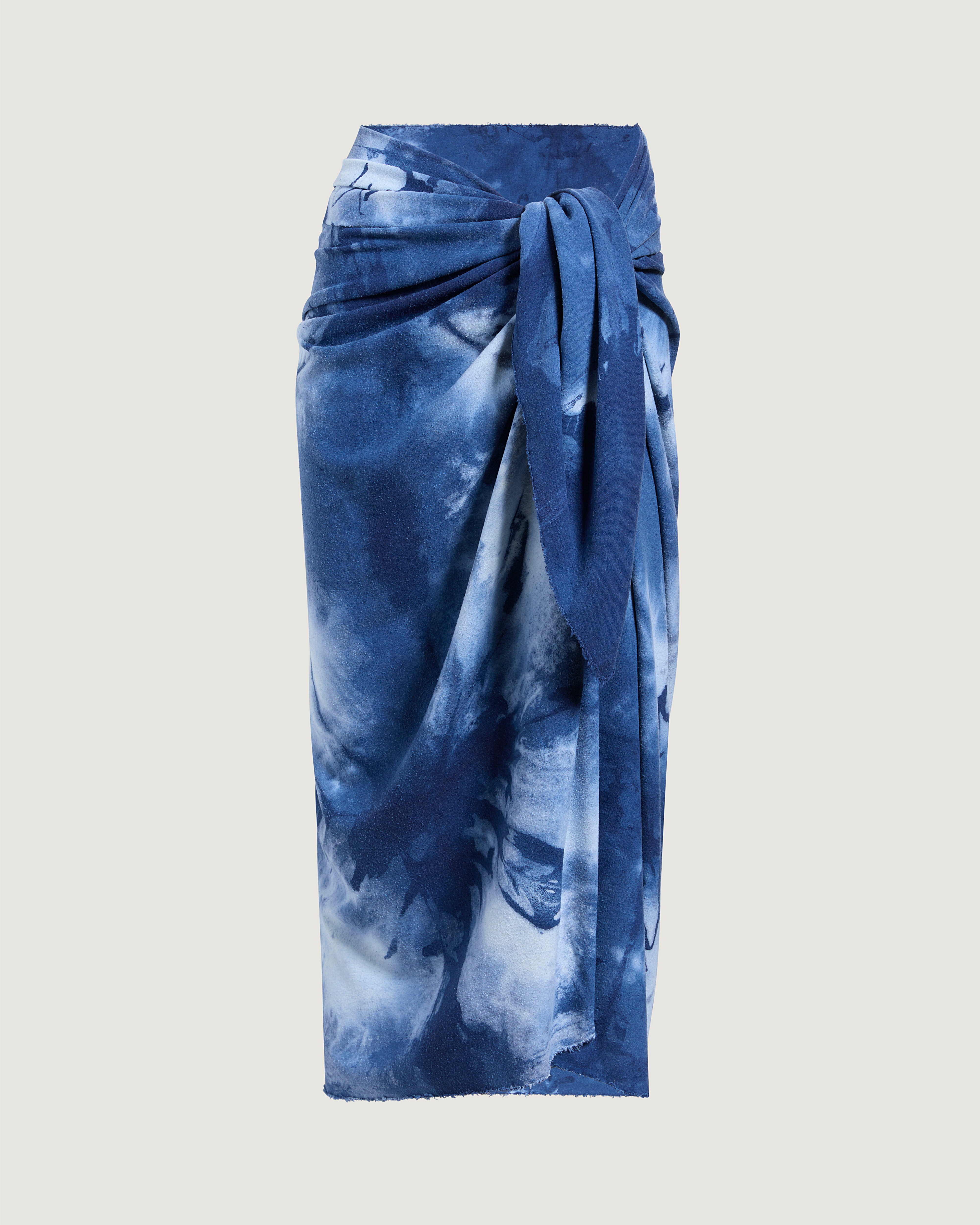 Blue tie-dye sarong on a light gray background