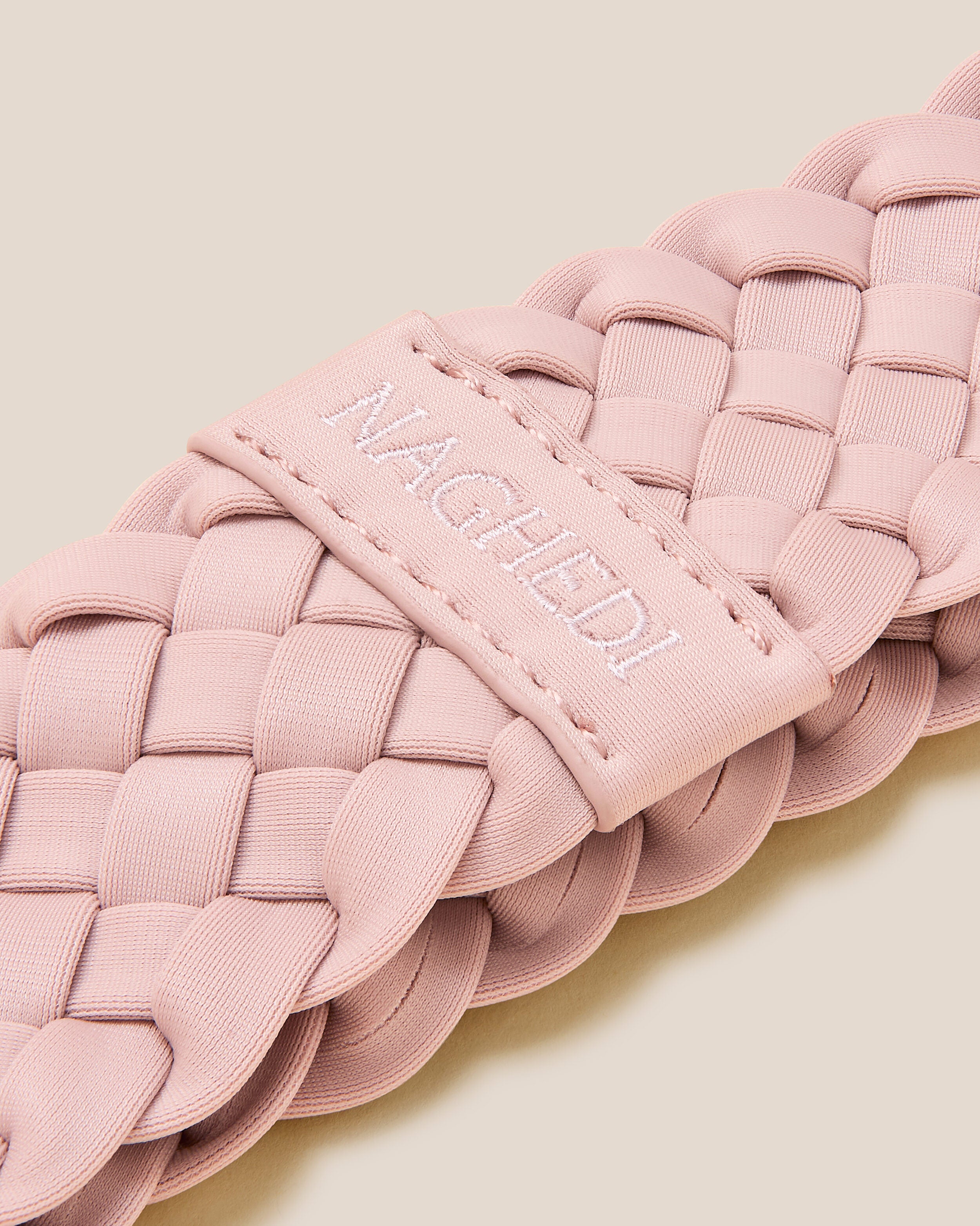 Close-up of handwoven detailing on Rivage Headband in Petal.