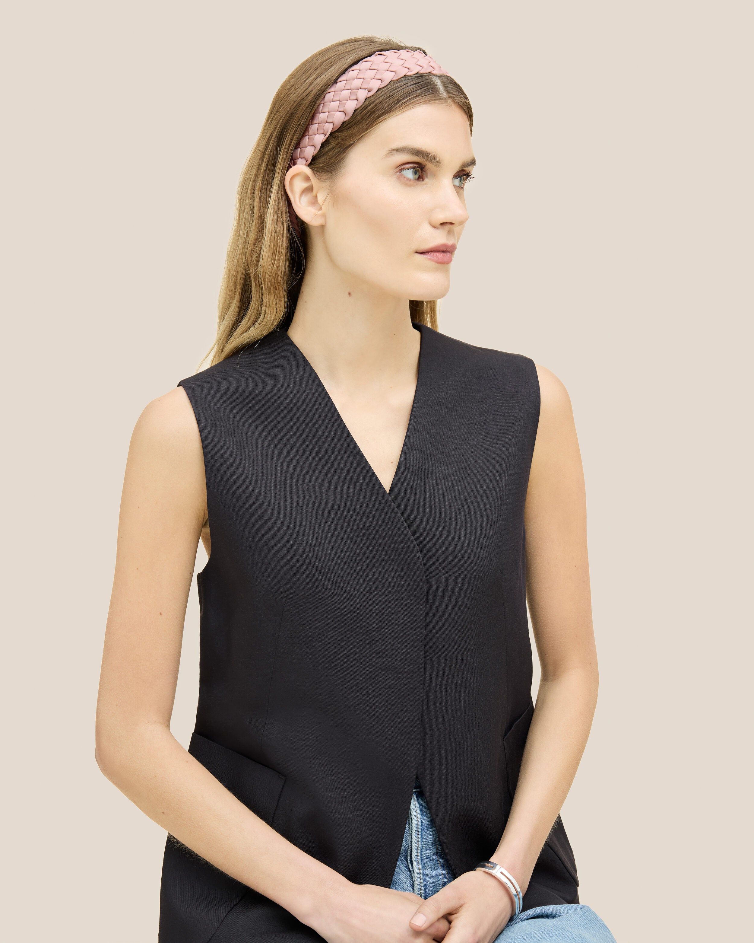 Rivage Headband in Petal shown on model to illustrate scale and soft silhouette.